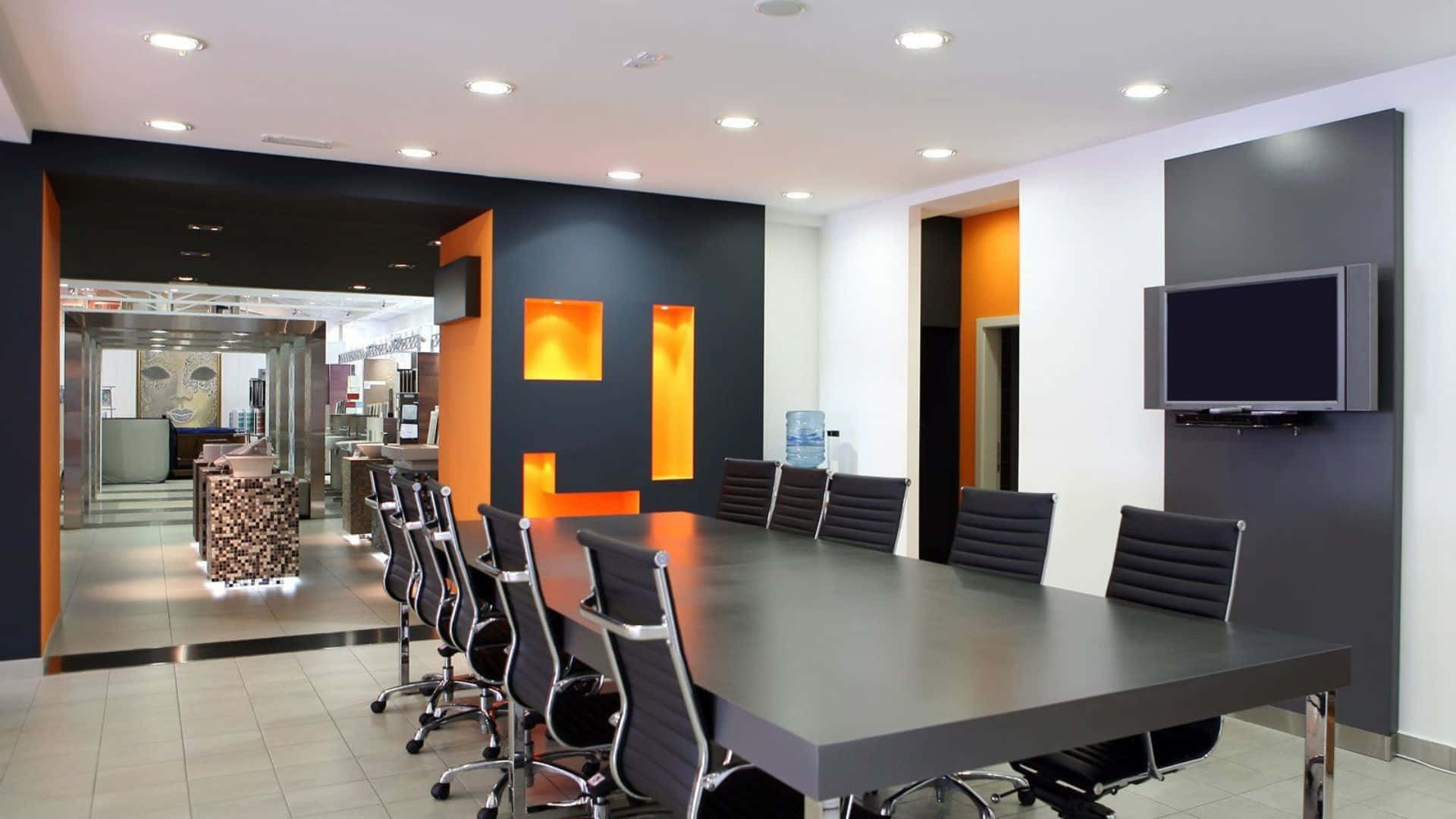 A Conference Room With Orange Walls And Black Furniture
