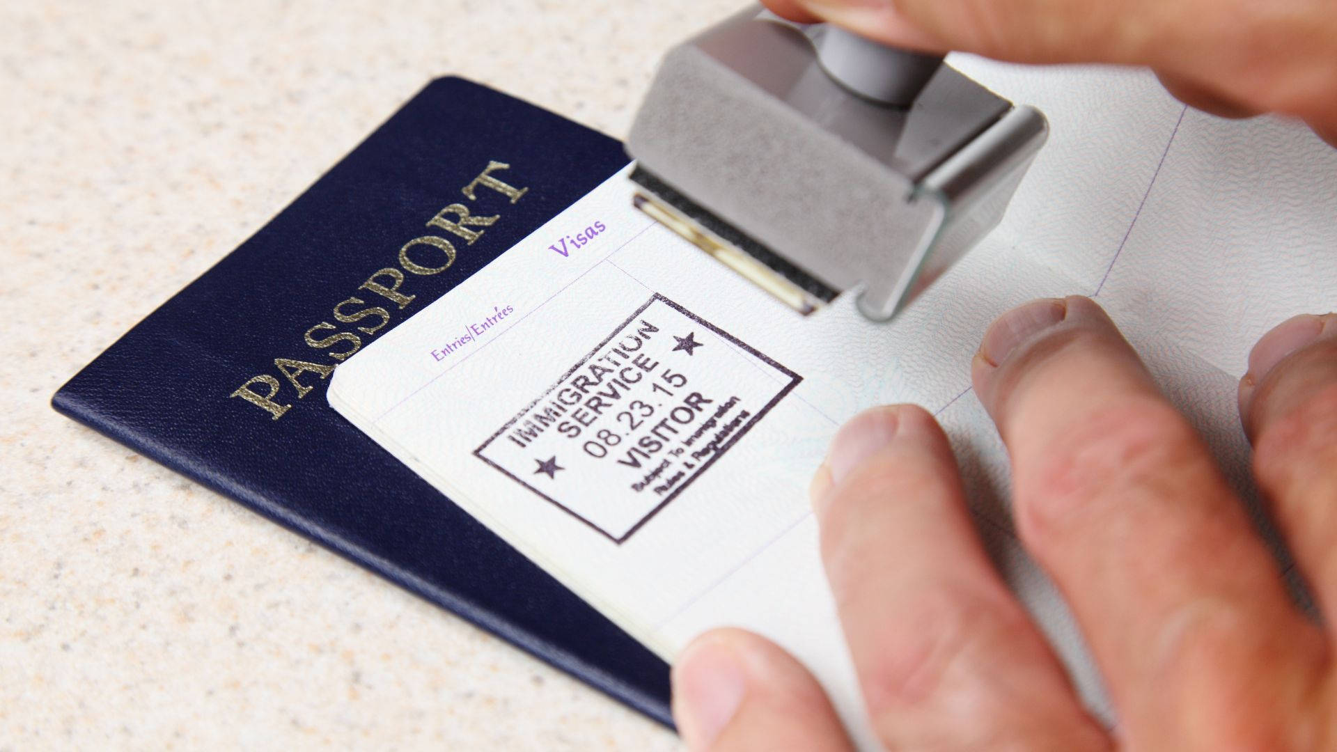 Officer Stamping On Passport Visa Wallpaper