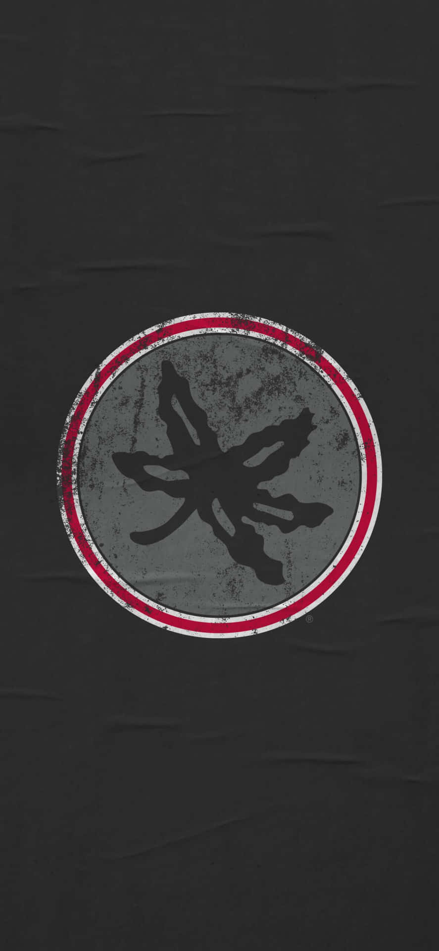 A Black Shirt With A Red And White Logo Wallpaper