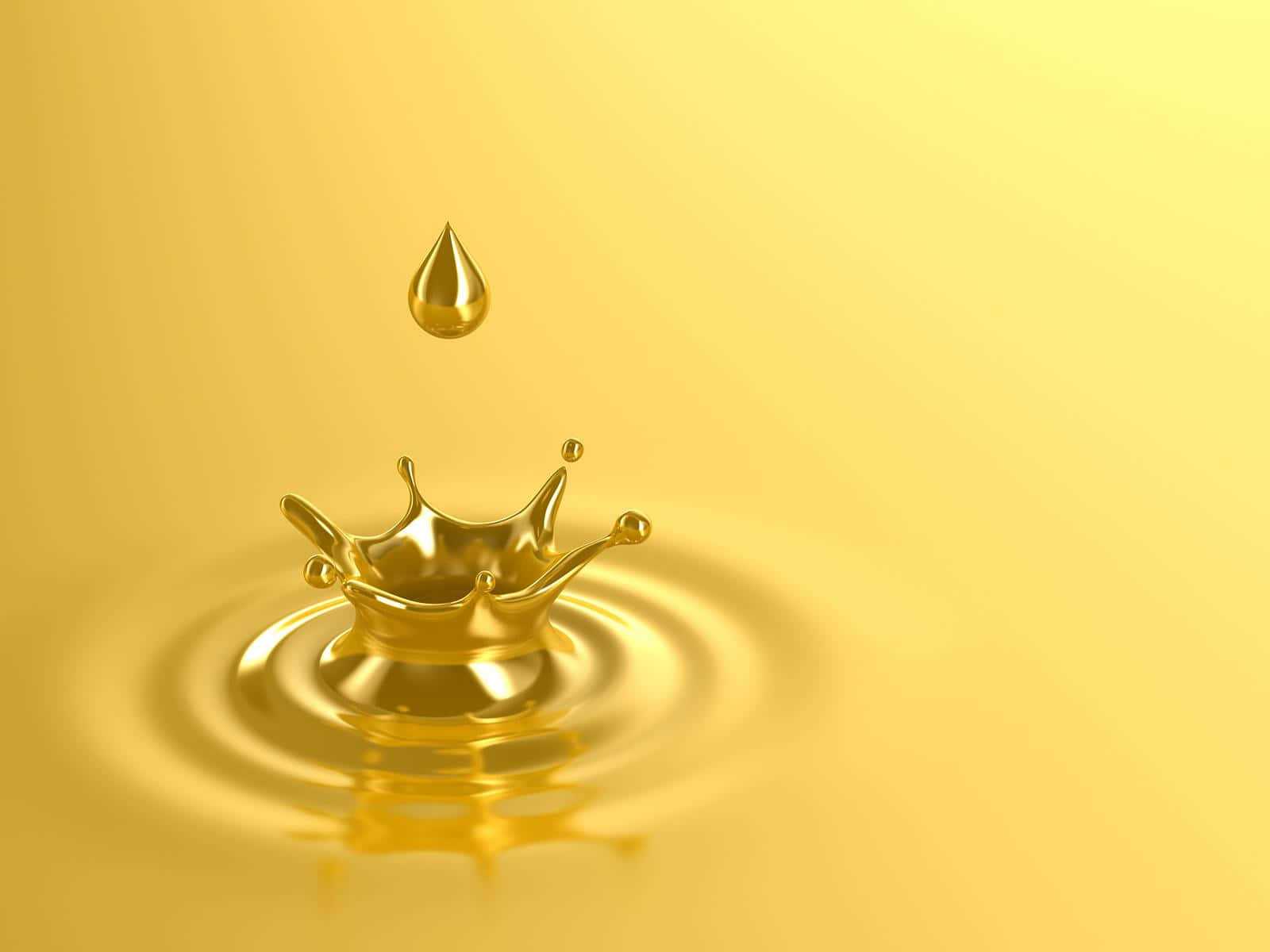 Unagoccia D'oro Di Olio Sta Cadendo Nell'acqua