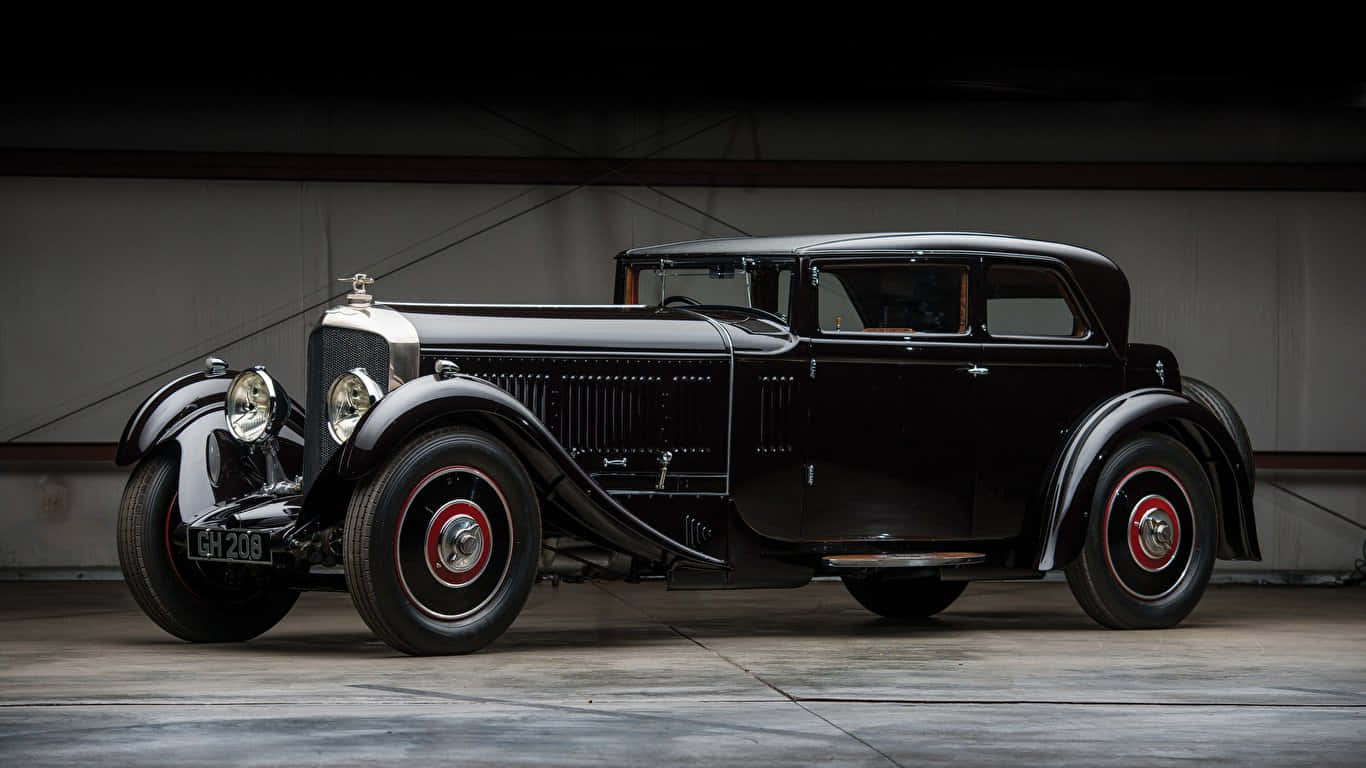 En gammel 1930 Bentley Speed Six kabriolet gennemfører en elegant håndformet design Wallpaper
