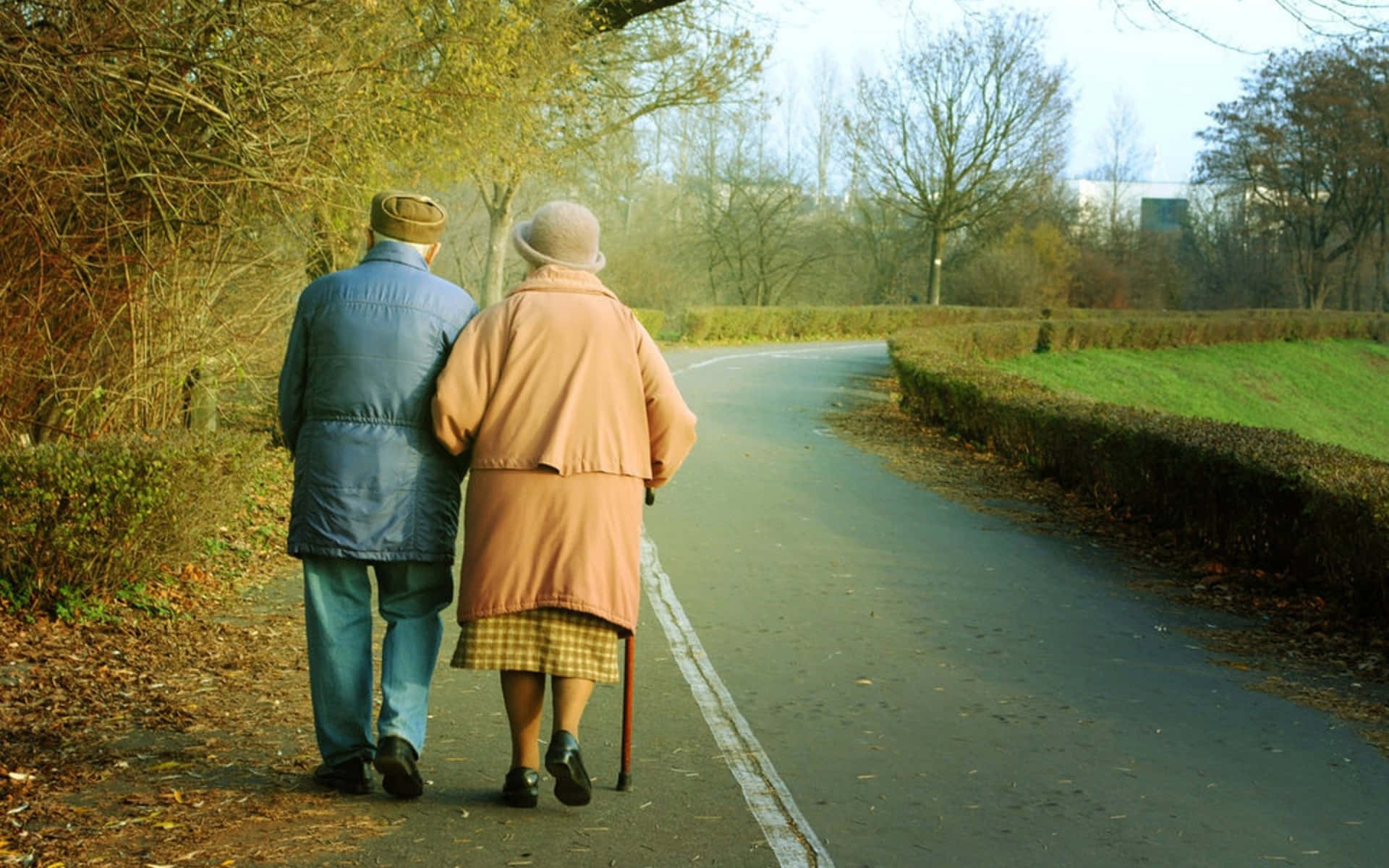 Old Couple Walking In The Street Background