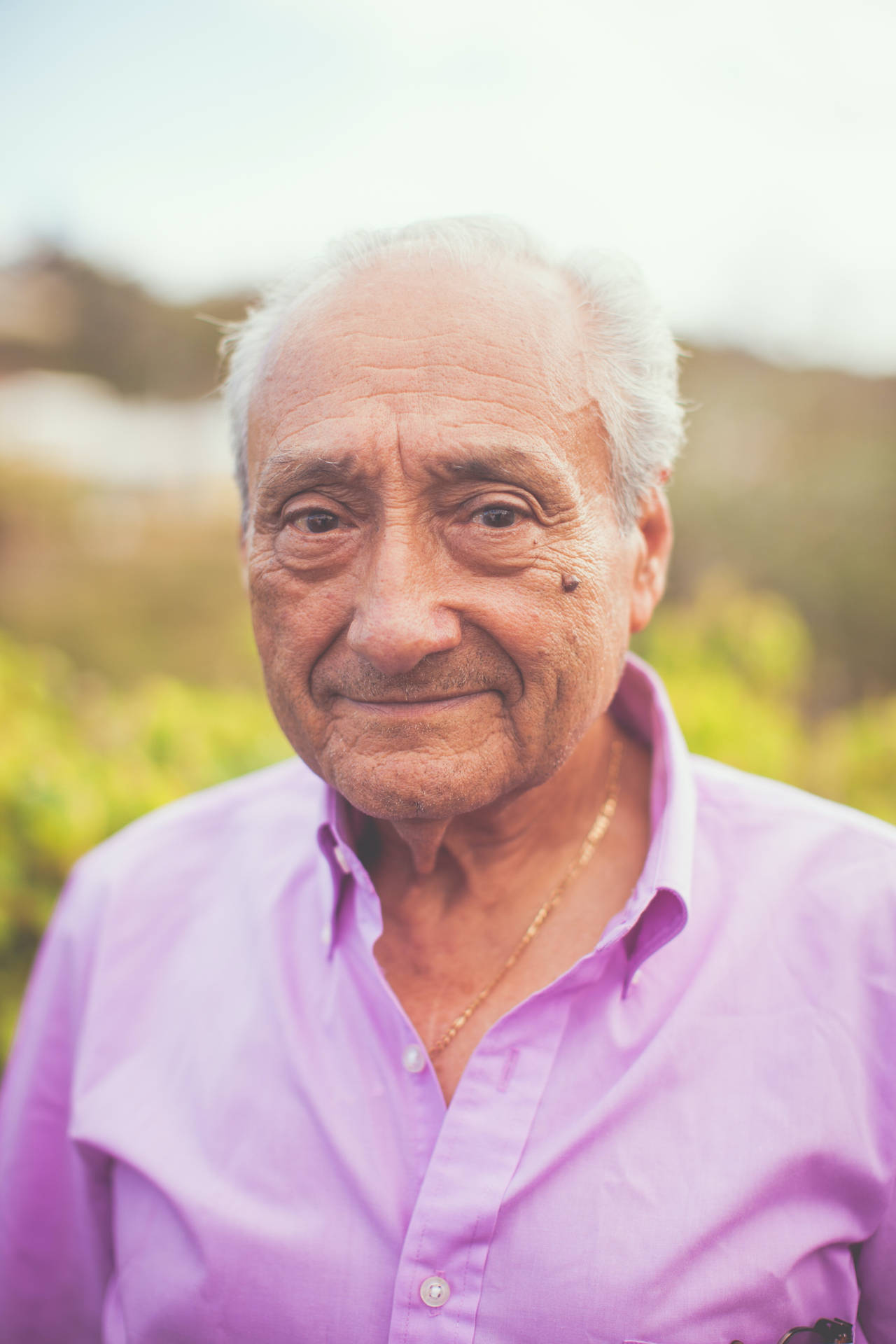 Old Man In Purple Shirt Portrait Wallpaper