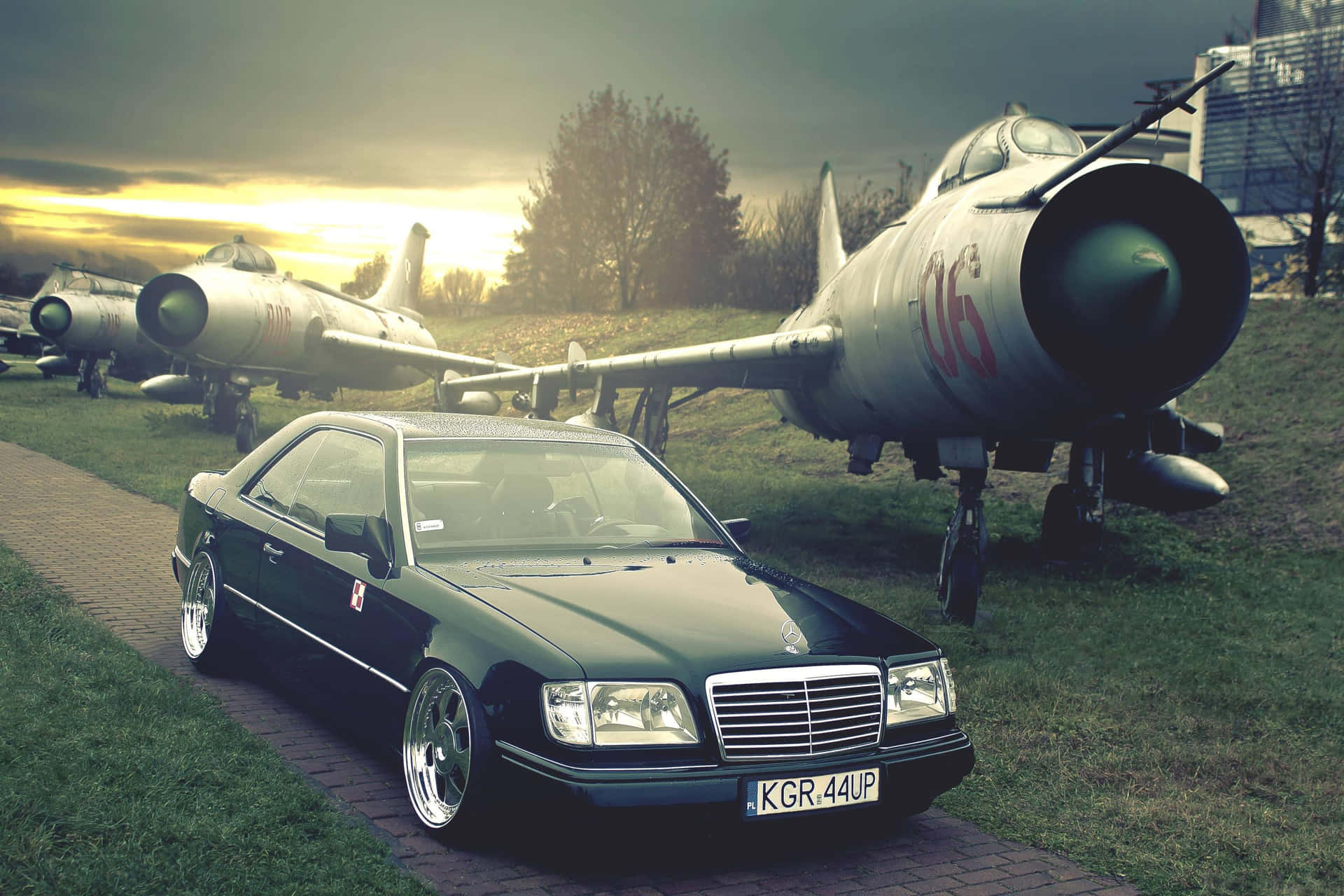 Old Mercedes Benz Parked Beside an Airplane Wallpaper