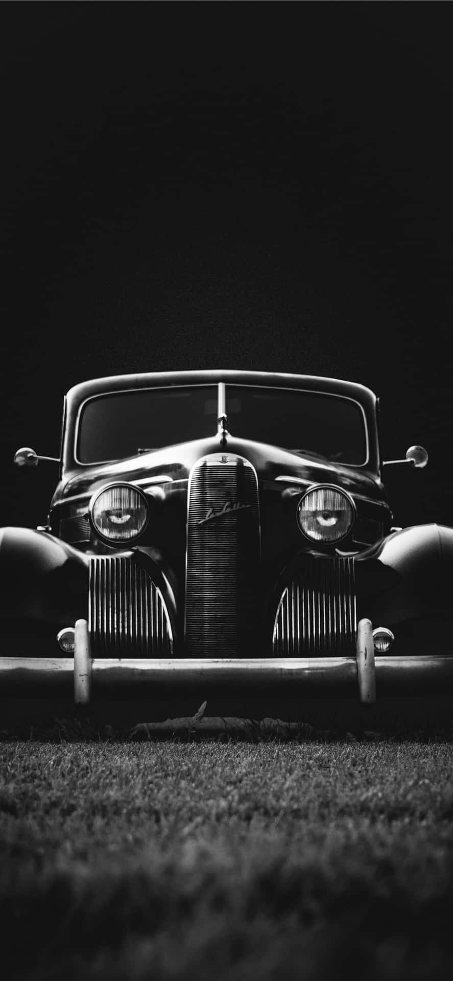 A Black And White Photograph Of An Old Car Wallpaper