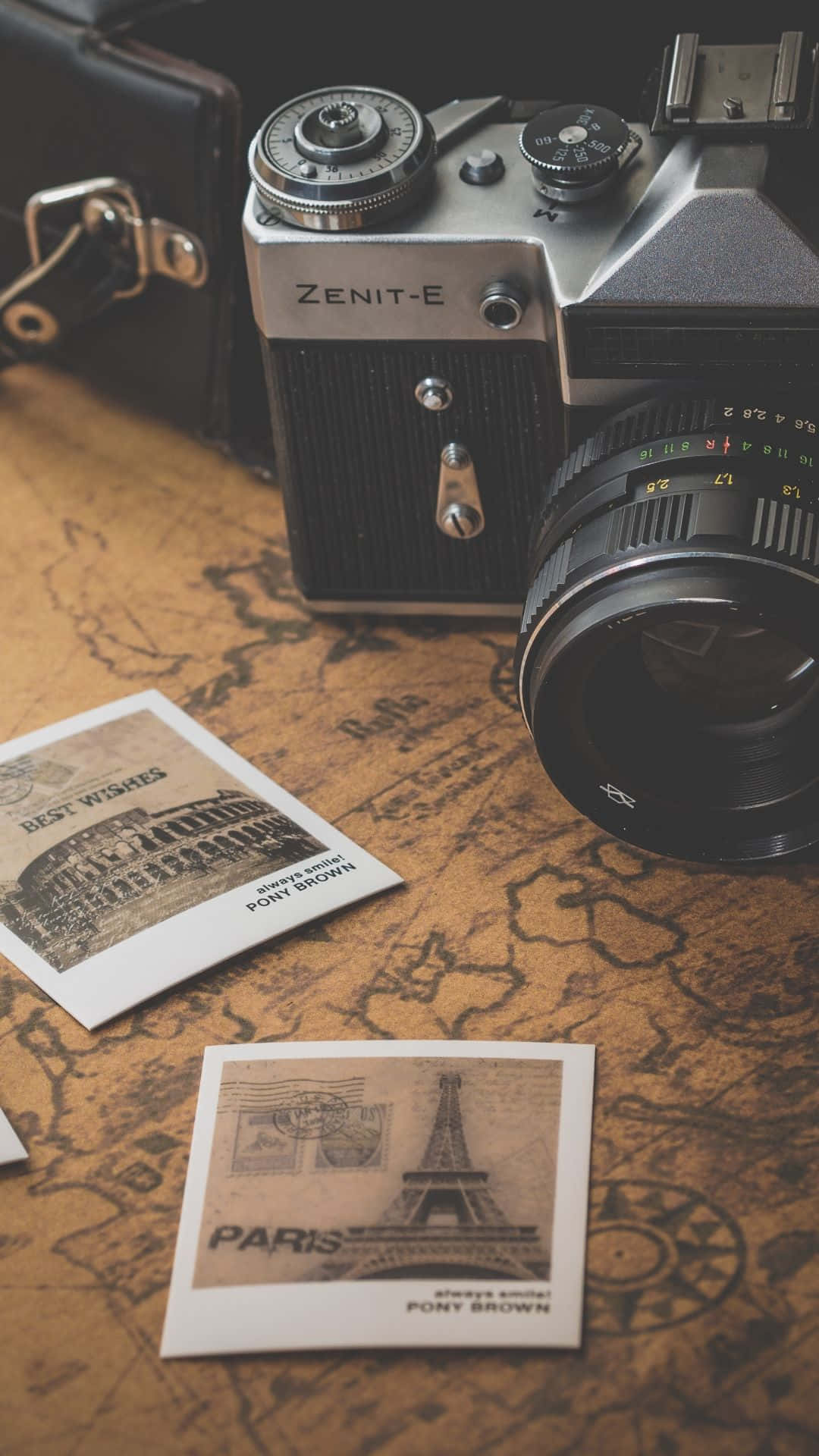 Vintage Camera And A Map On A Table Wallpaper