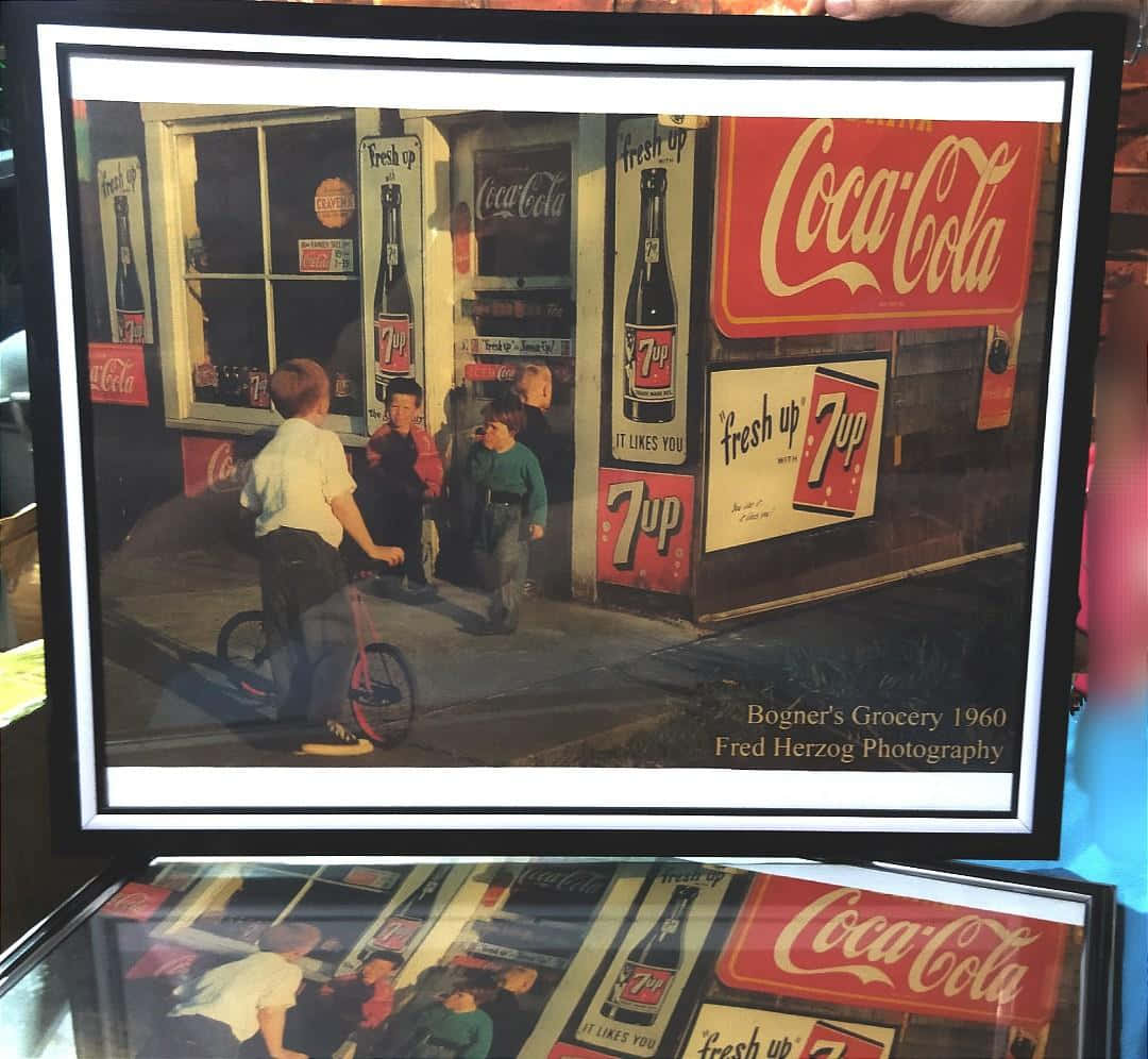 A Framed Photo Of A Coca Cola Store