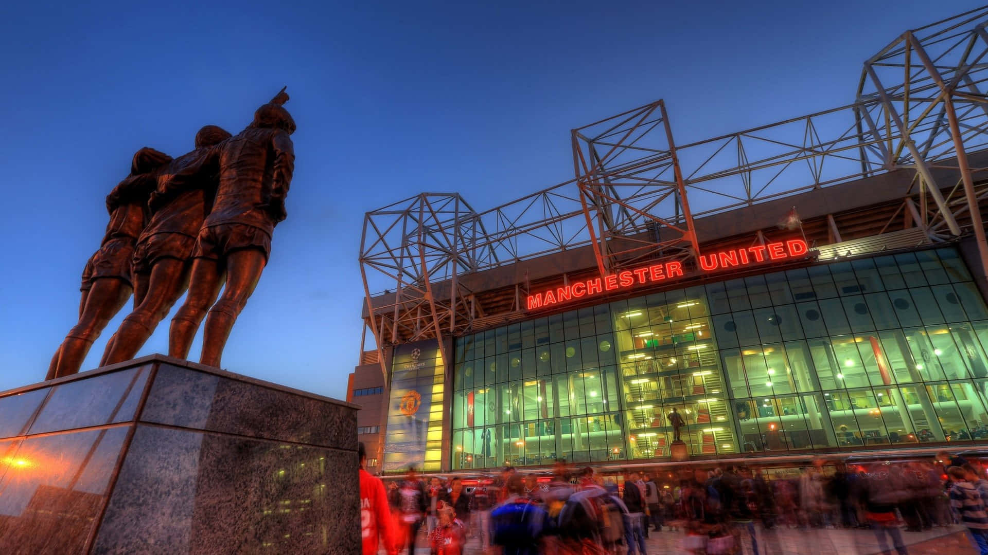 Old Trafford Stadium Dusk Statue Fans Wallpaper