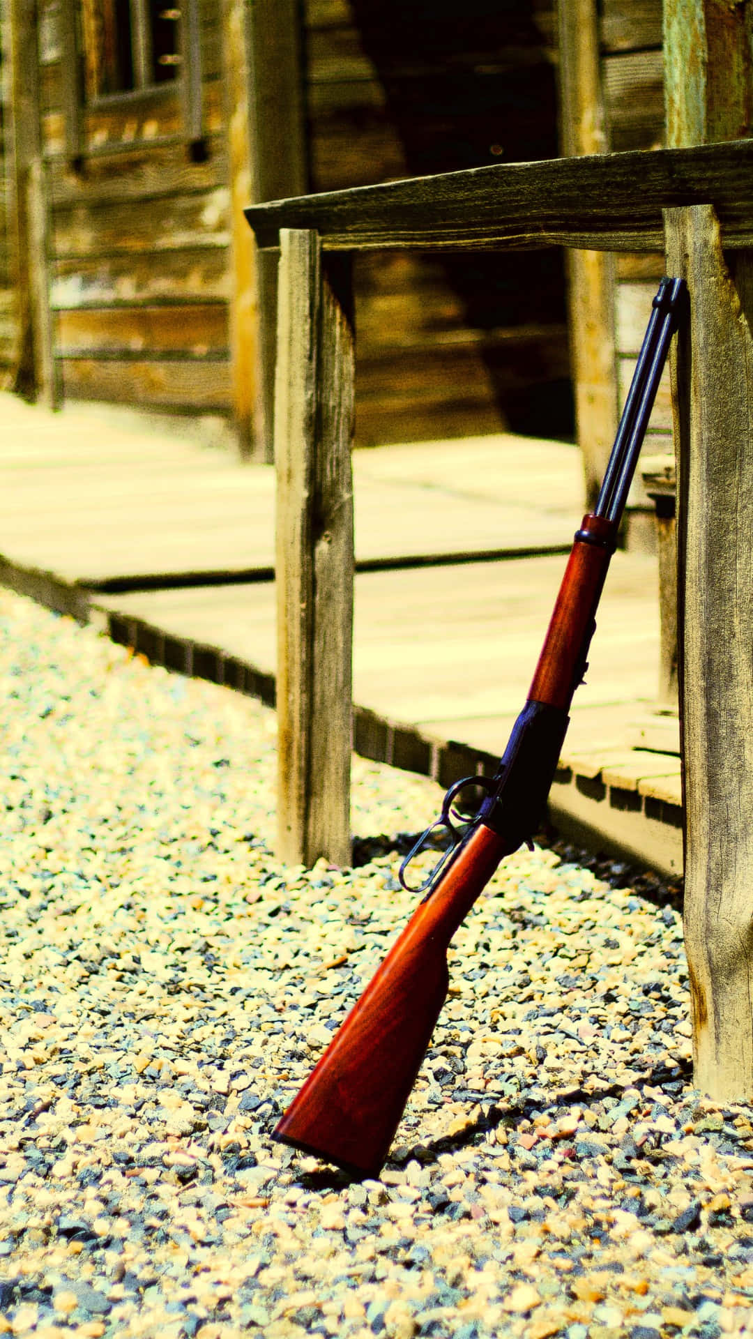 Old Western Rifle Leaning Against Building.jpg Wallpaper