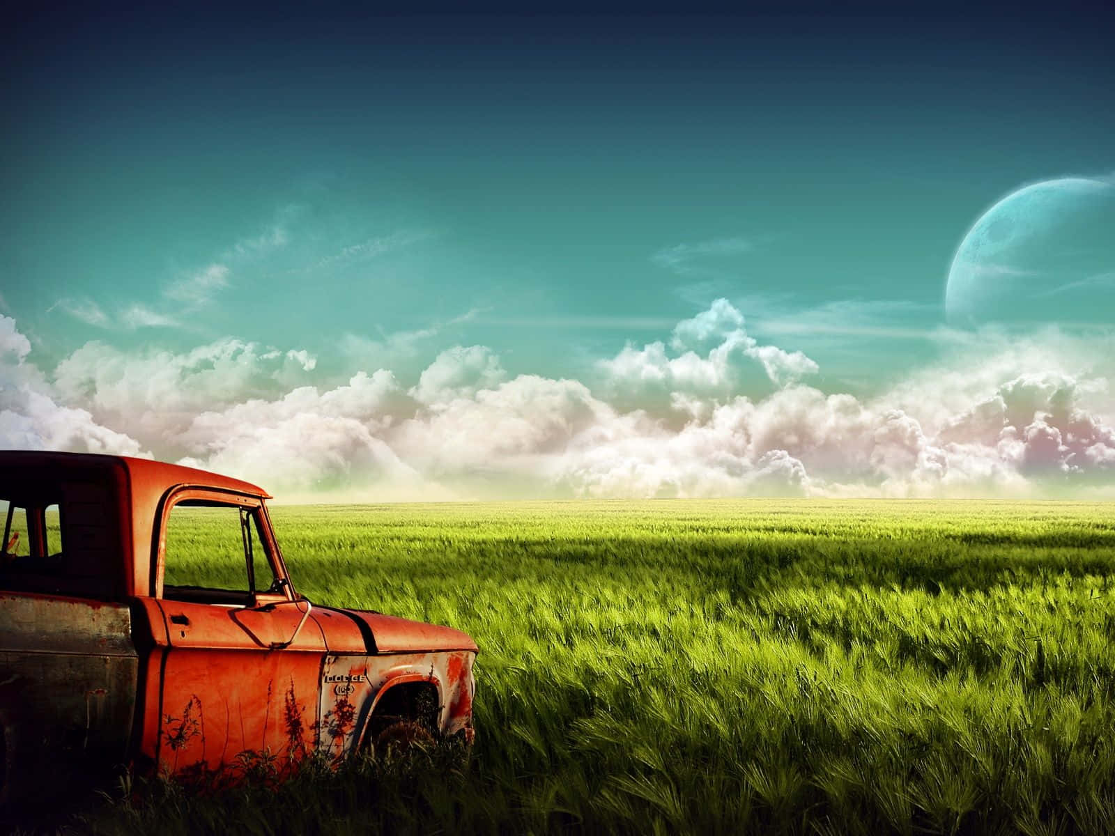 An Old Truck In A Field With Clouds