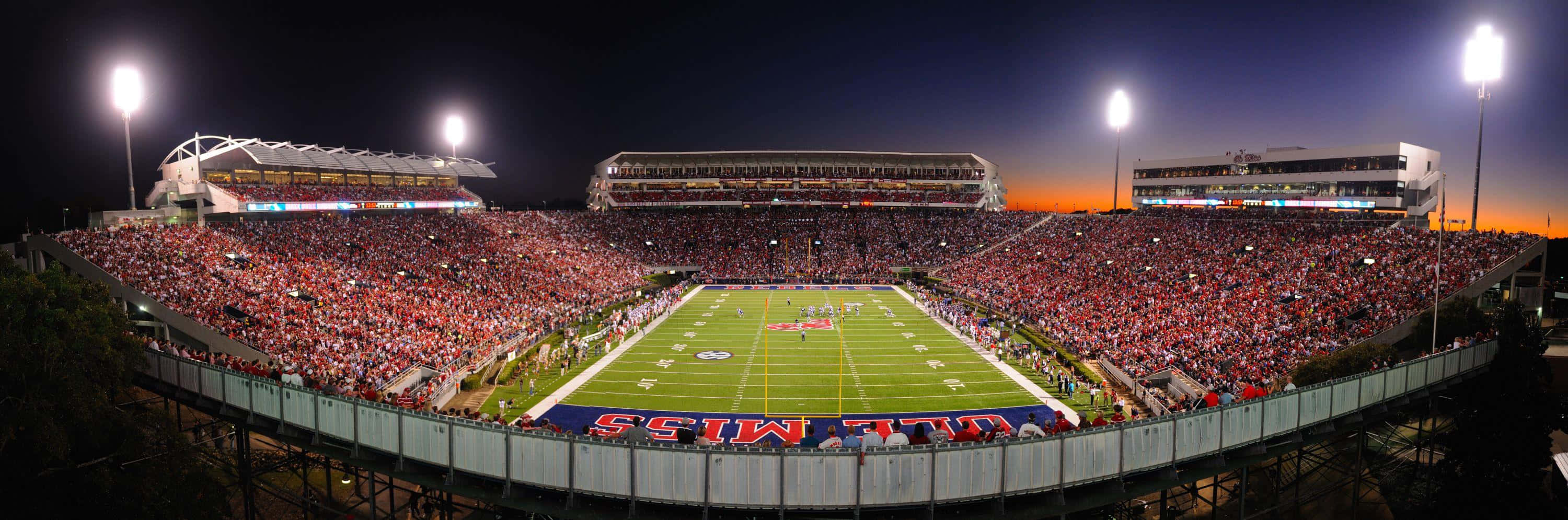 Cheering On The Rebels At The Ole Miss Stadium Wallpaper
