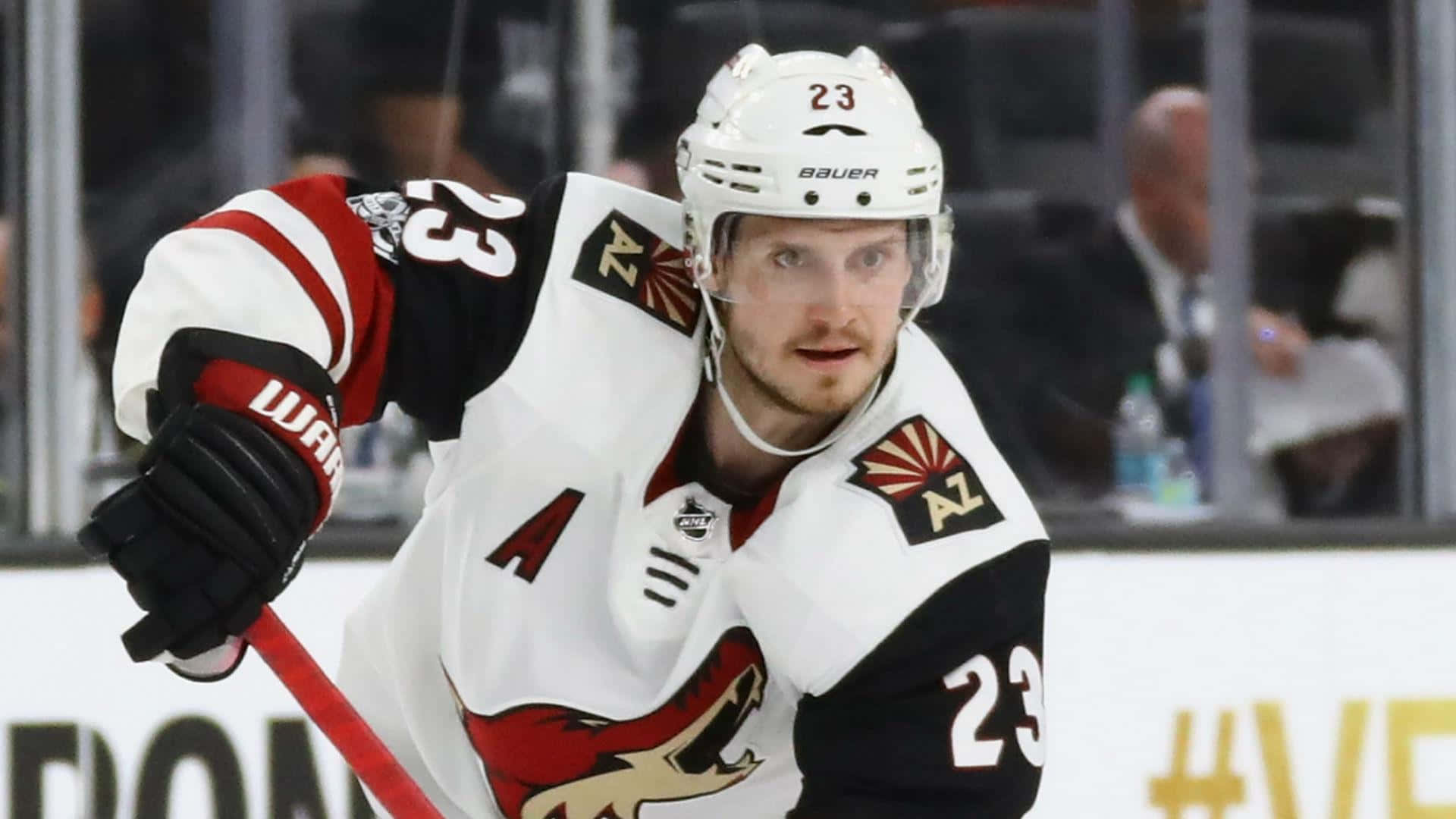 Oliver Ekman-Larsson in a Competitive Face-Off Wallpaper