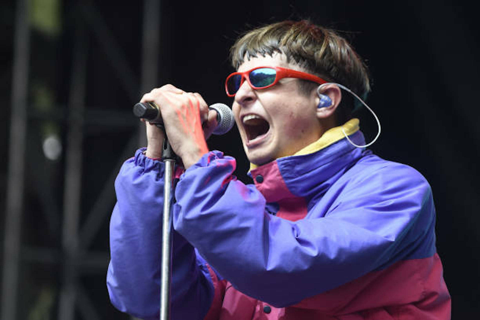 Oliver Tree Singing On Microphone Wallpaper