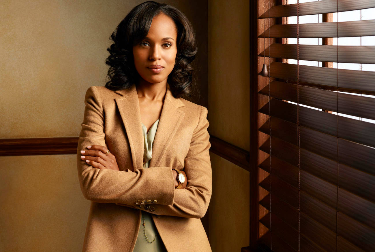 Professional Olivia Pope from "Scandal" in a sophisticated brown suit Wallpaper