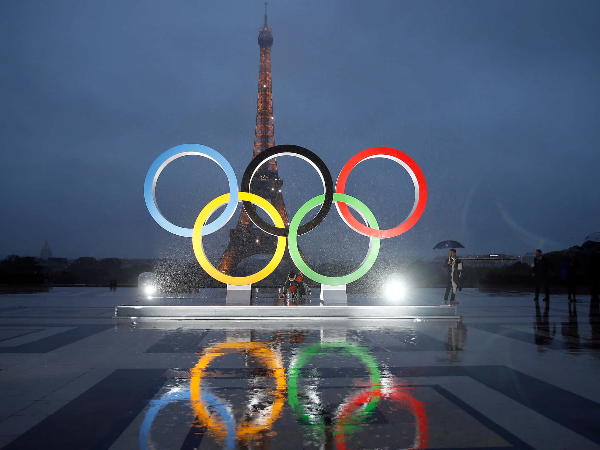 Olympic_ Rings_and_ Eiffel_ Tower_in_ Rain Wallpaper