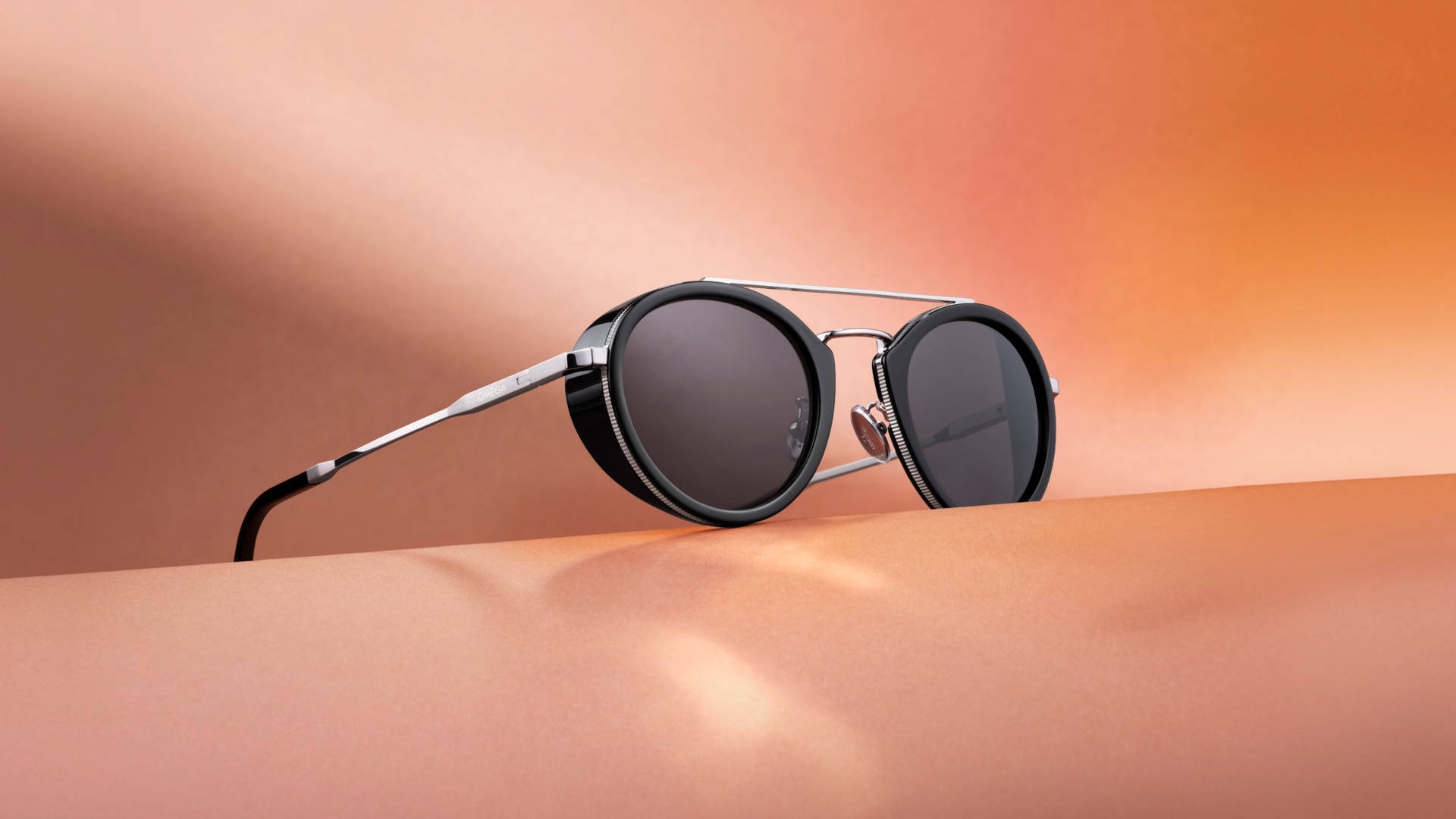 Omega Black Unisex Round Style Sunglasses Wallpaper