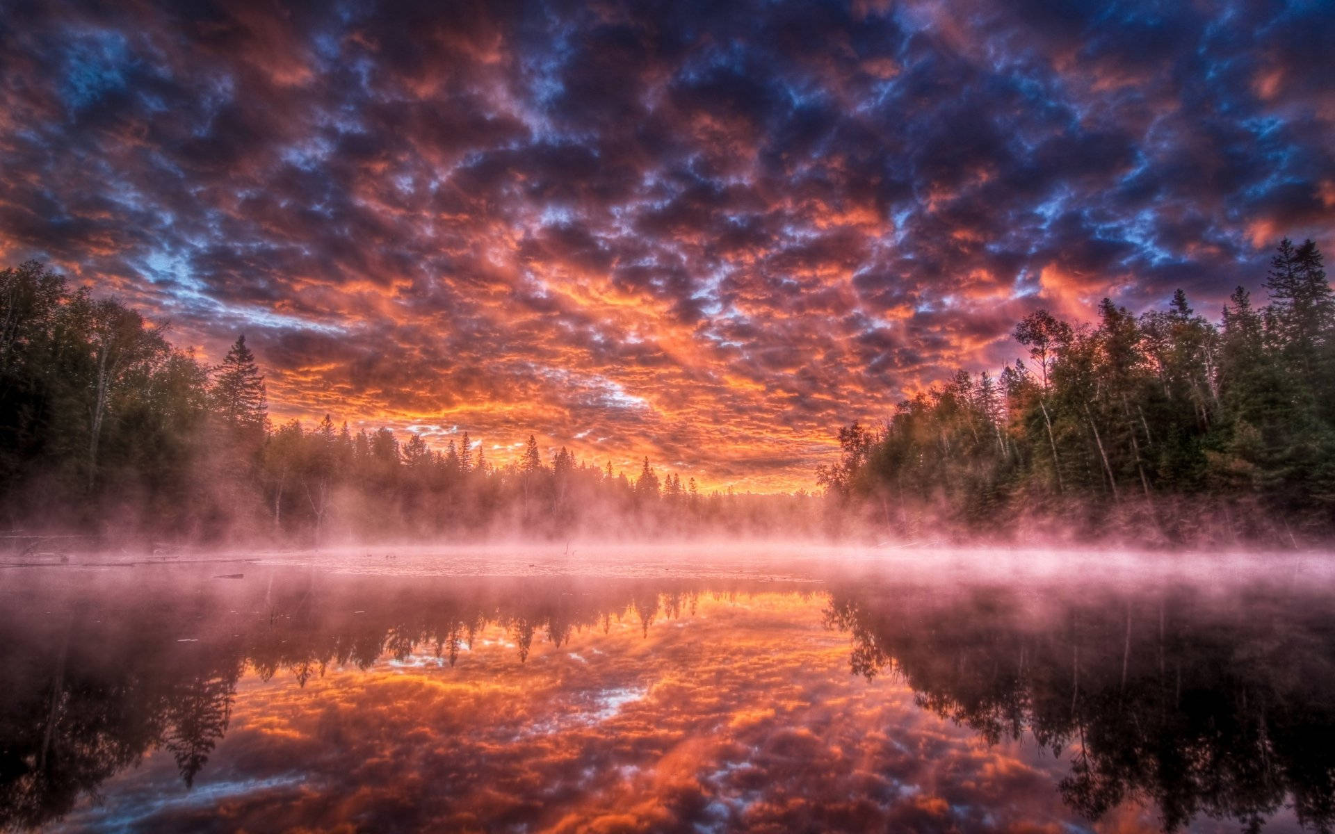 Ominous Clouds Over A Foggy Lake Wallpaper