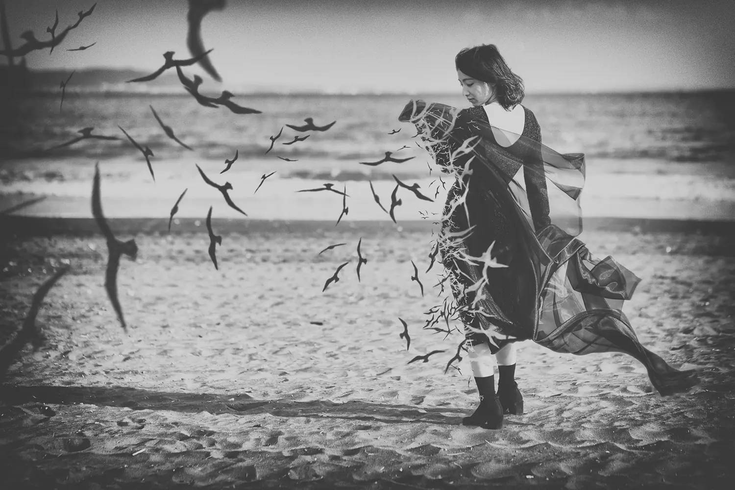 Mysterious Woman on an Ominous Beach Wallpaper