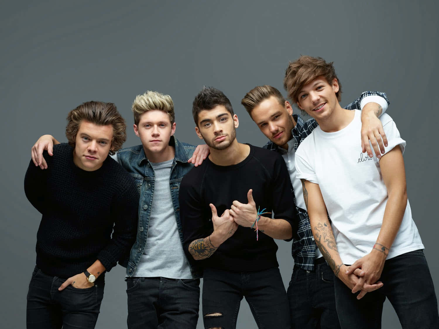 Download The members of One Direction shine! | Wallpapers.com