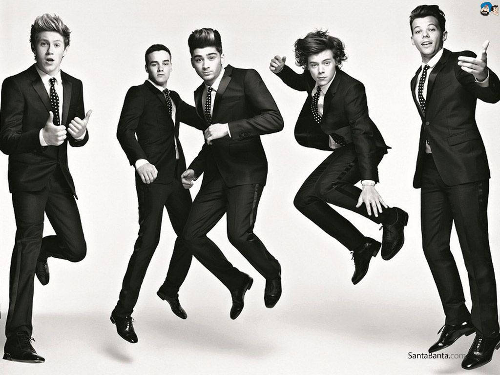One Direction performing in all black suits Wallpaper