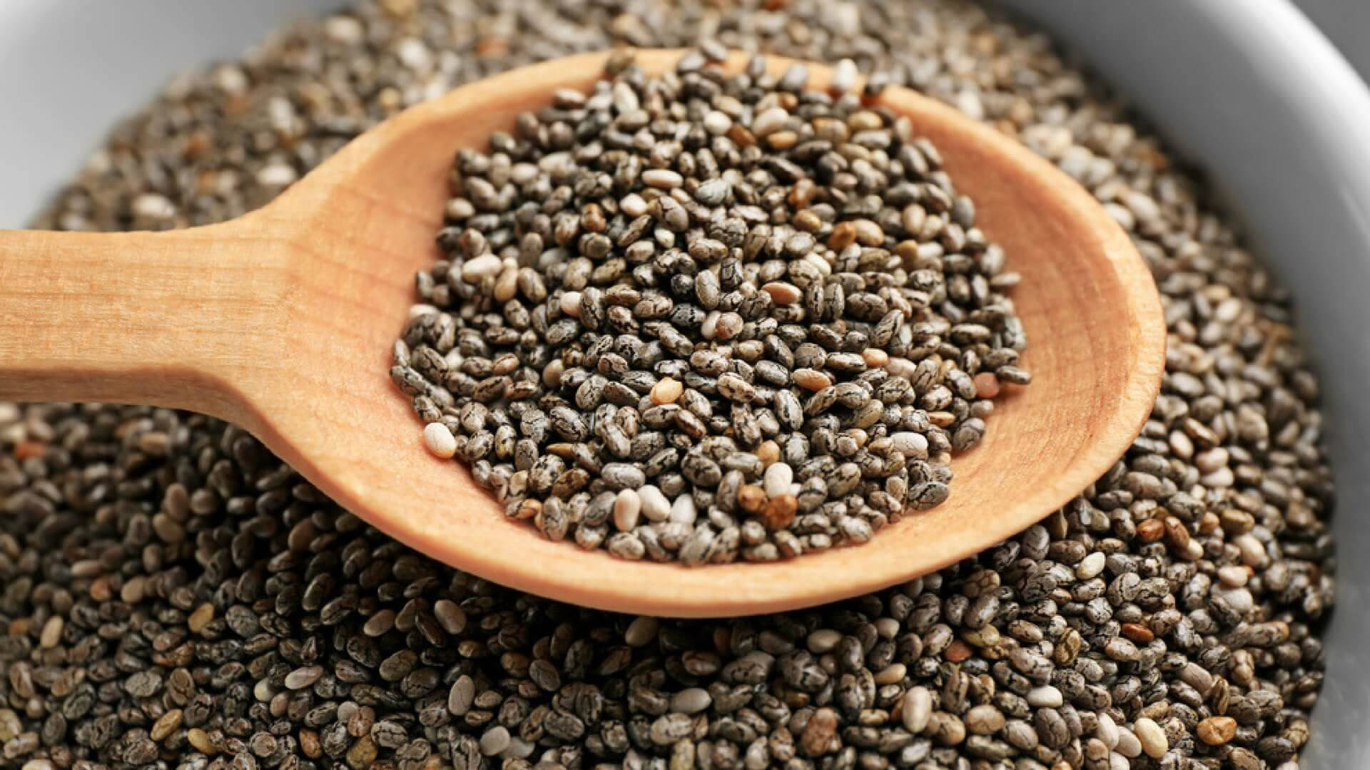 A Wooden Scoop of Nutrient-dense Chia Seeds Wallpaper