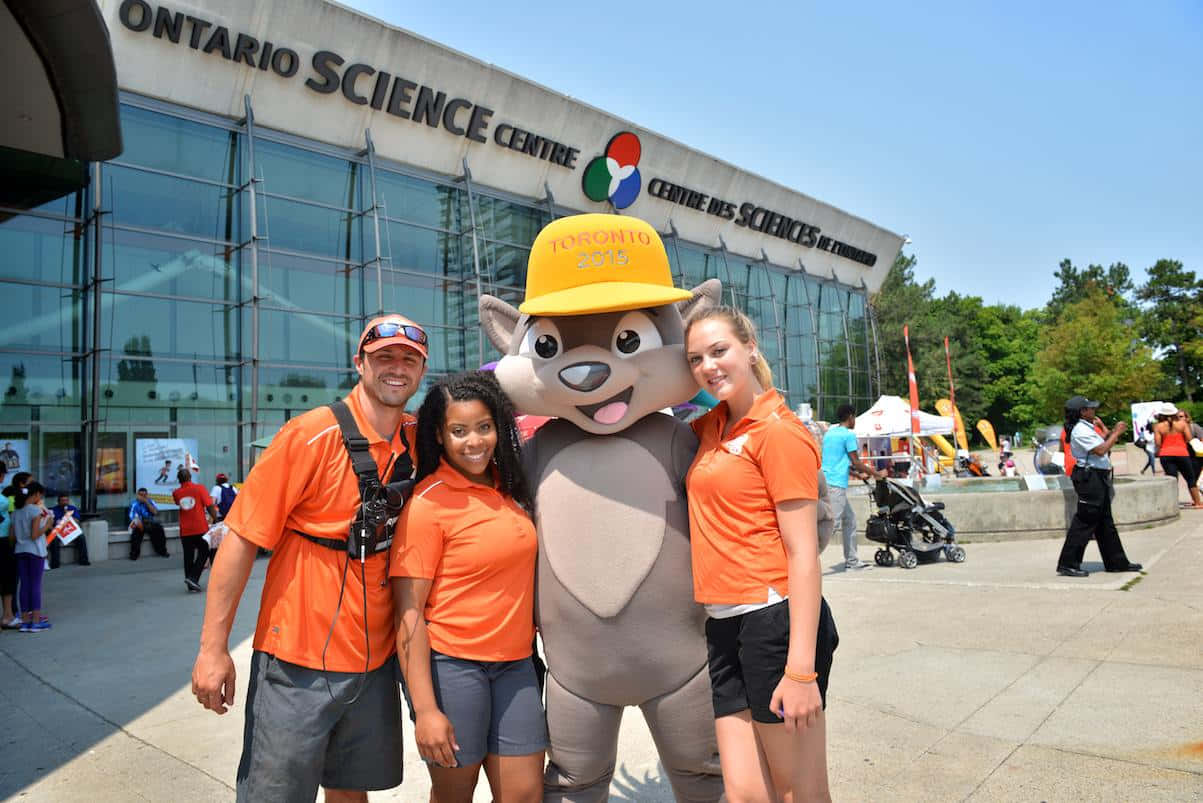 Ontario Science Centre Visitors With Mascot Wallpaper