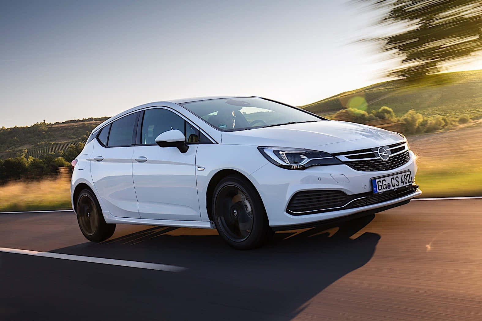 "The sleek and stylish Opel Astra in natural setting." Wallpaper