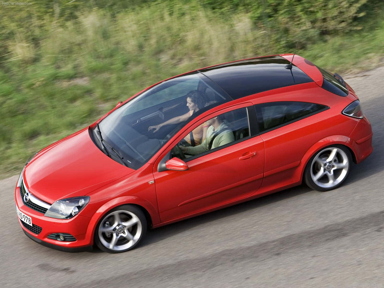 Sleek and Stylish Opel Astra in Motion Wallpaper