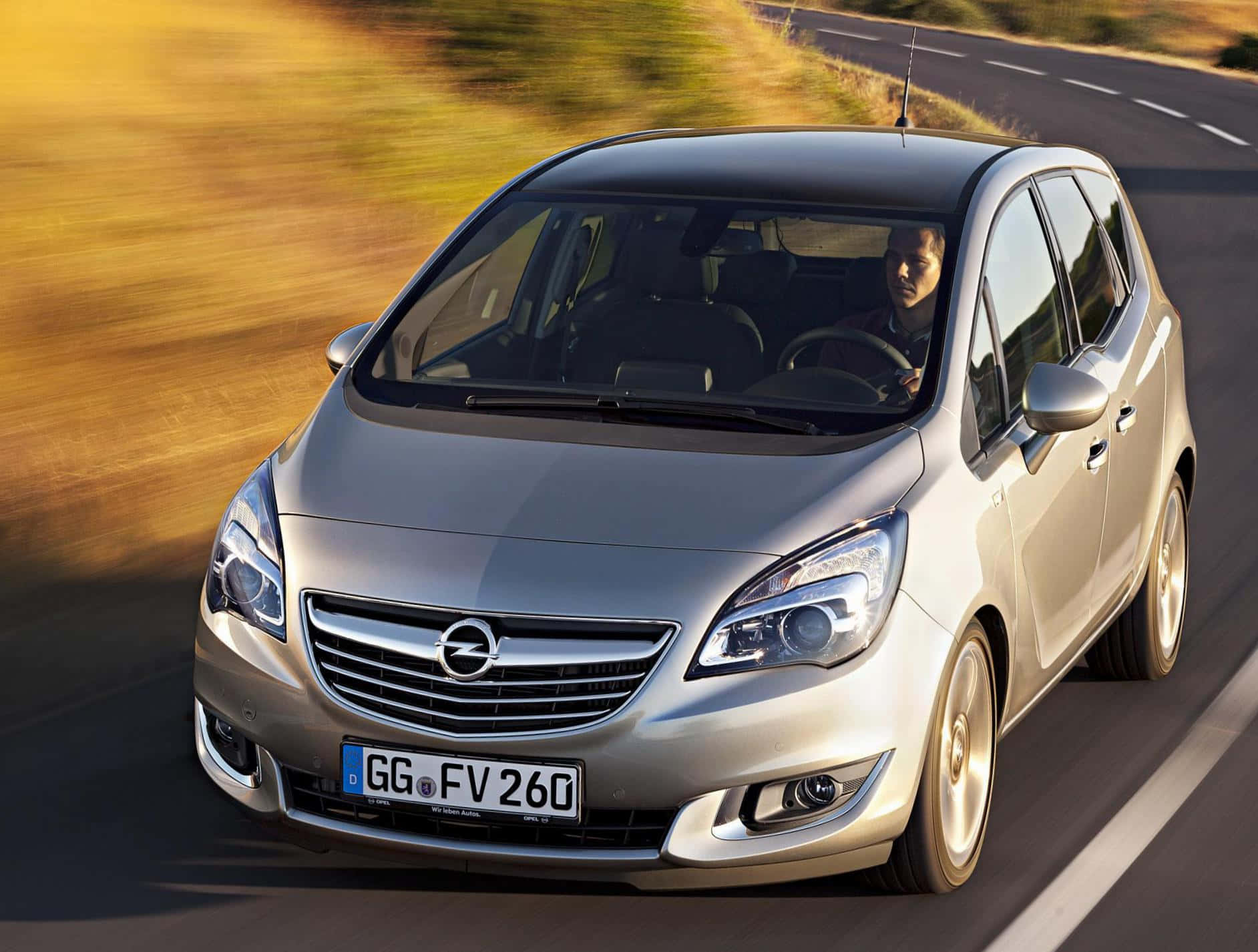 Opel Meriva Cruising Through The Dusk Wallpaper