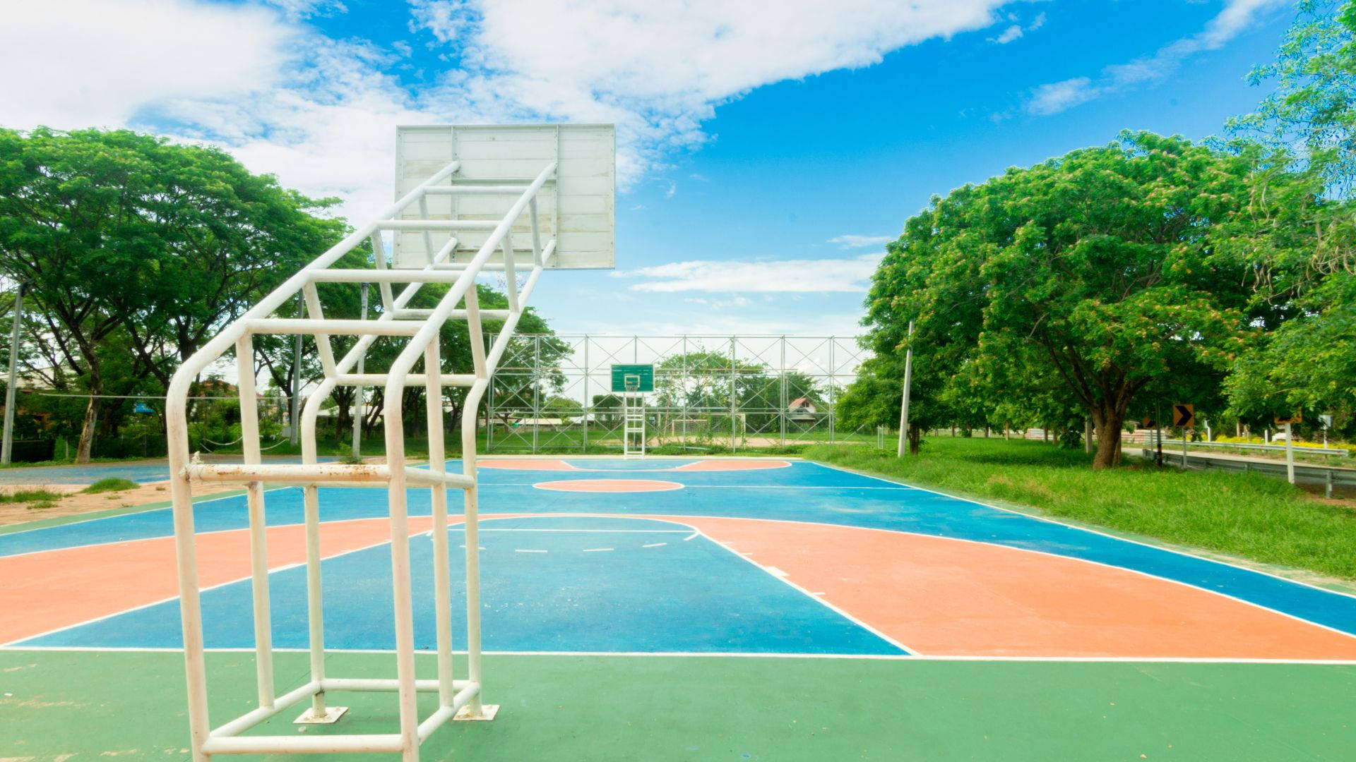Open Basketball Court In Summer Wallpaper