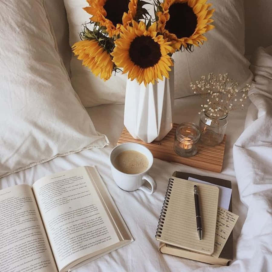 A Bed With A Book, Flowers And A Cup Of Coffee