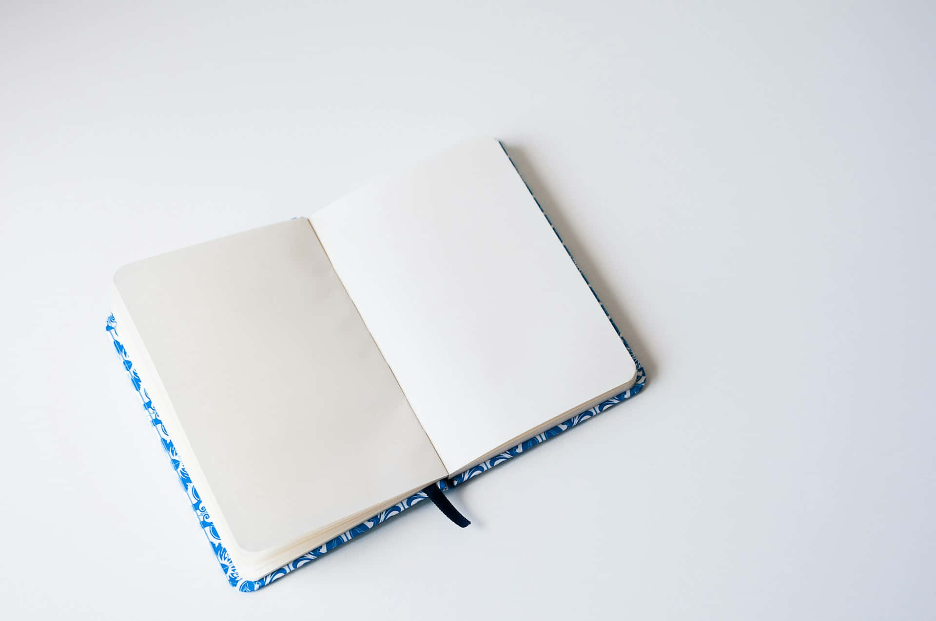 Open Notebookon White Background Wallpaper