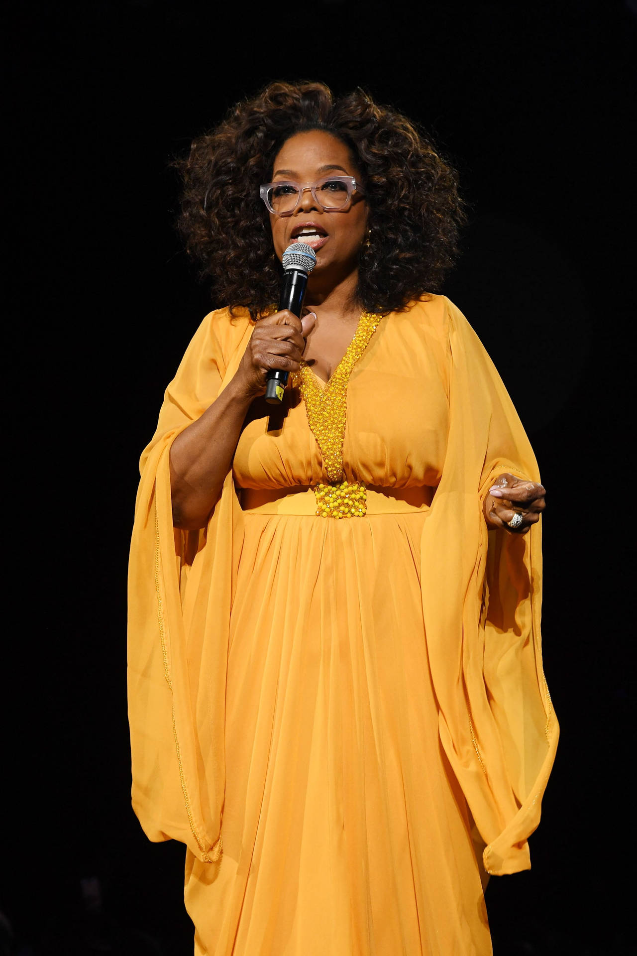 Oprah Winfrey In A Yellow Dress Background