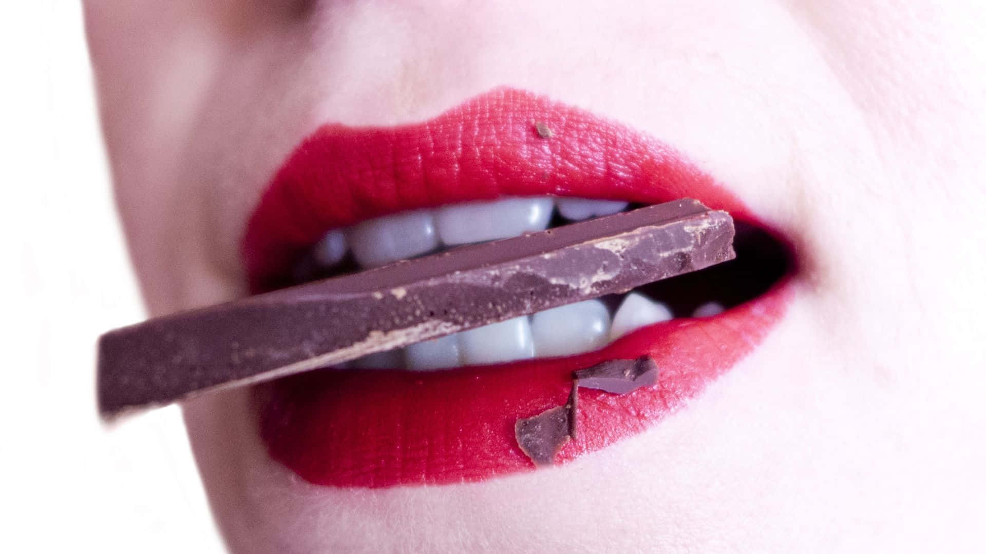 Oral Biting Chocolate Wallpaper