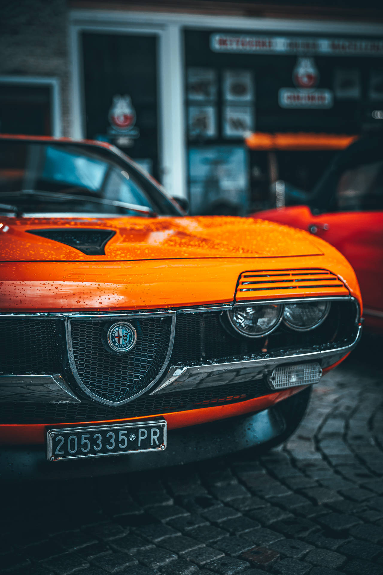 Orange Alfa Romeo Montreal Background