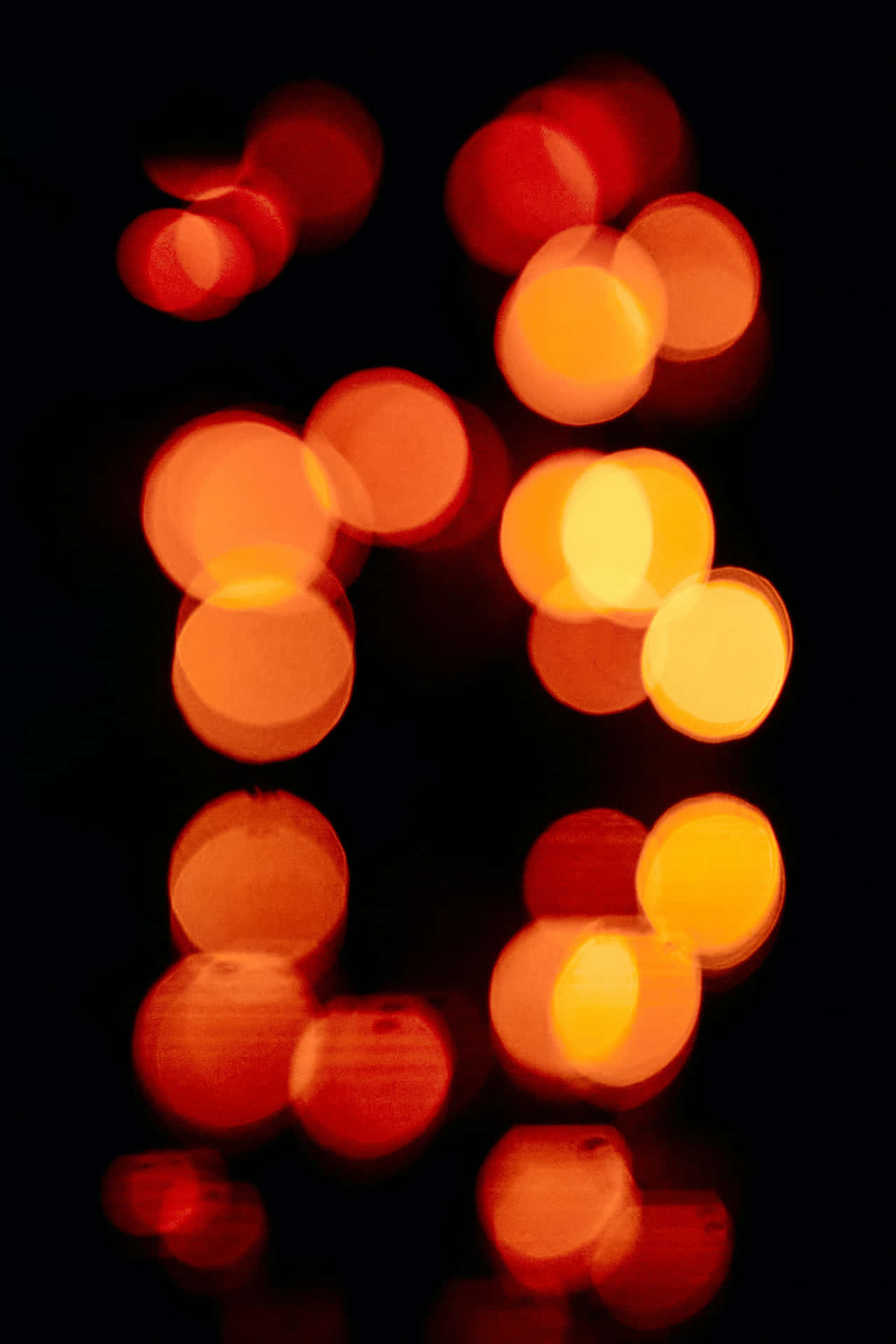 Orangeund Schwarzer Bokeh-licht Hintergrund