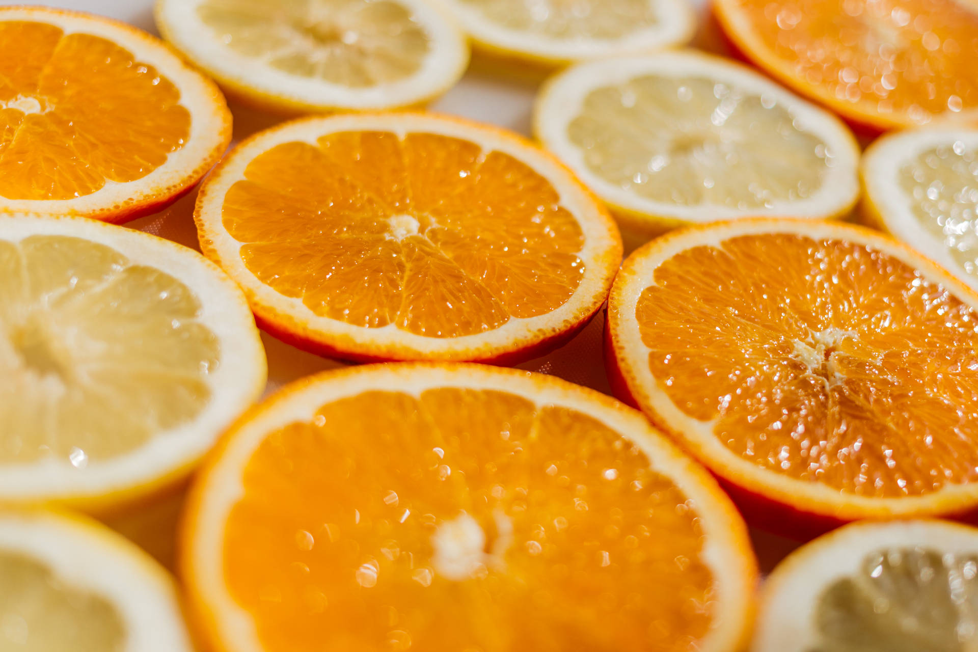 Enjoy the sweet and sour delight of orange and lemon slices! Wallpaper
