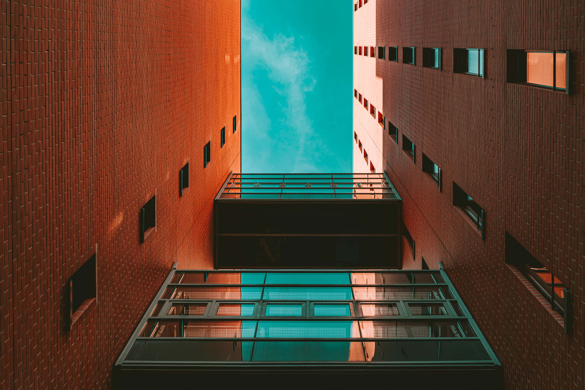 Building And Sky In Orange And Teal Wallpaper