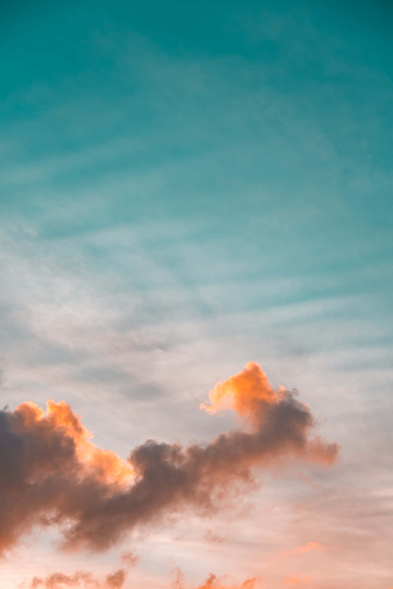 Cloudy Orange And Teal Sky Wallpaper