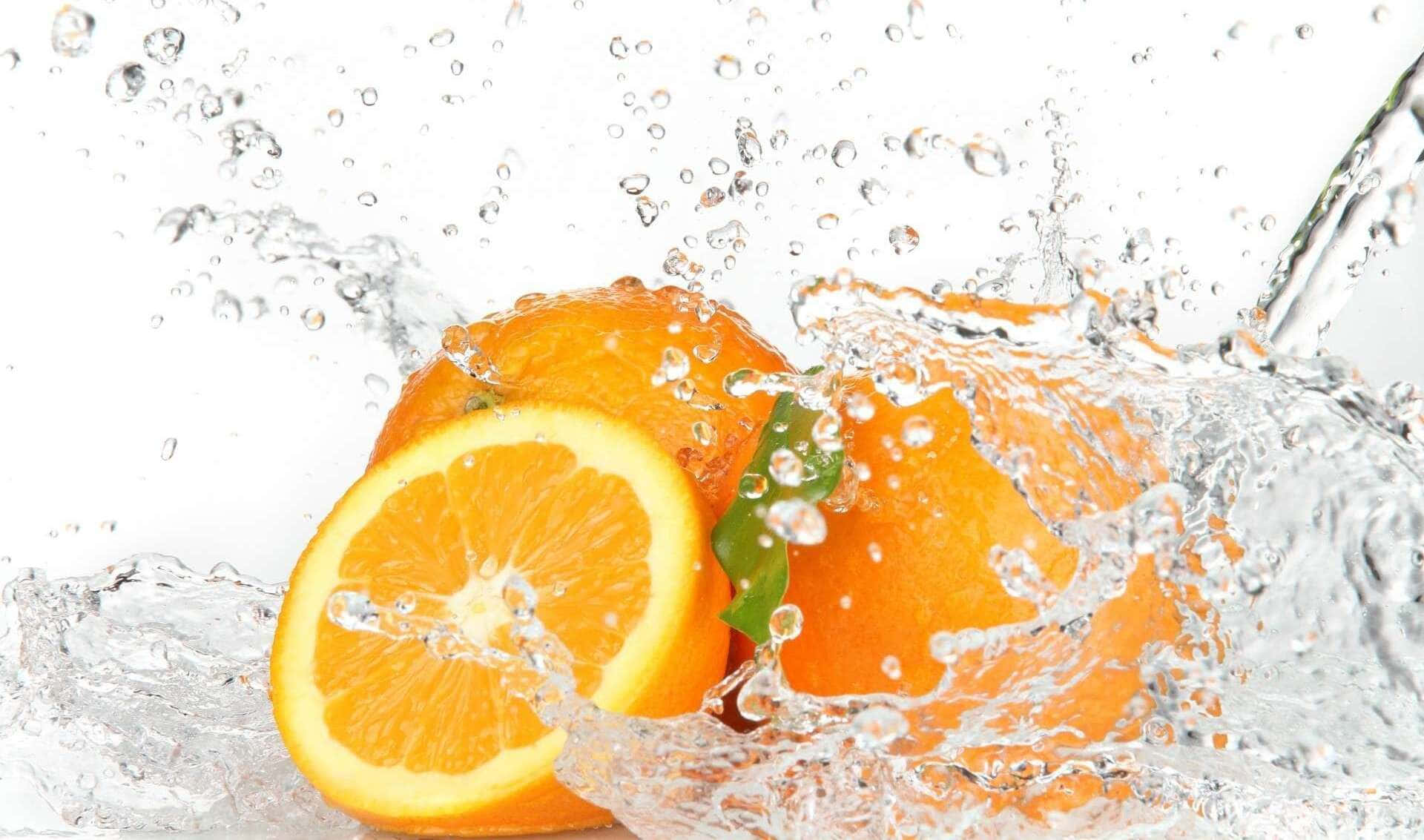 Two slice of orange fruit with some water splash or splatter look