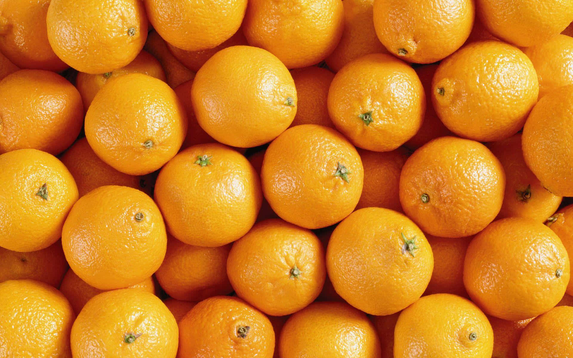 Fresh orange fruit on a vibrant background