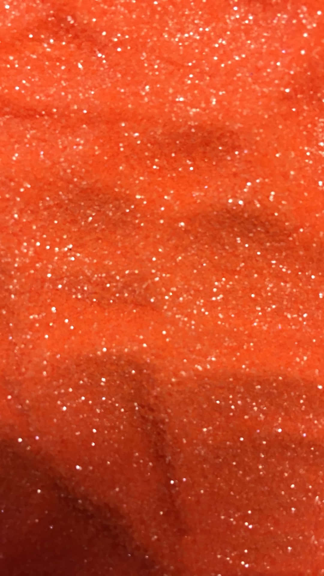 Shine bright with Orange Glitter Wallpaper