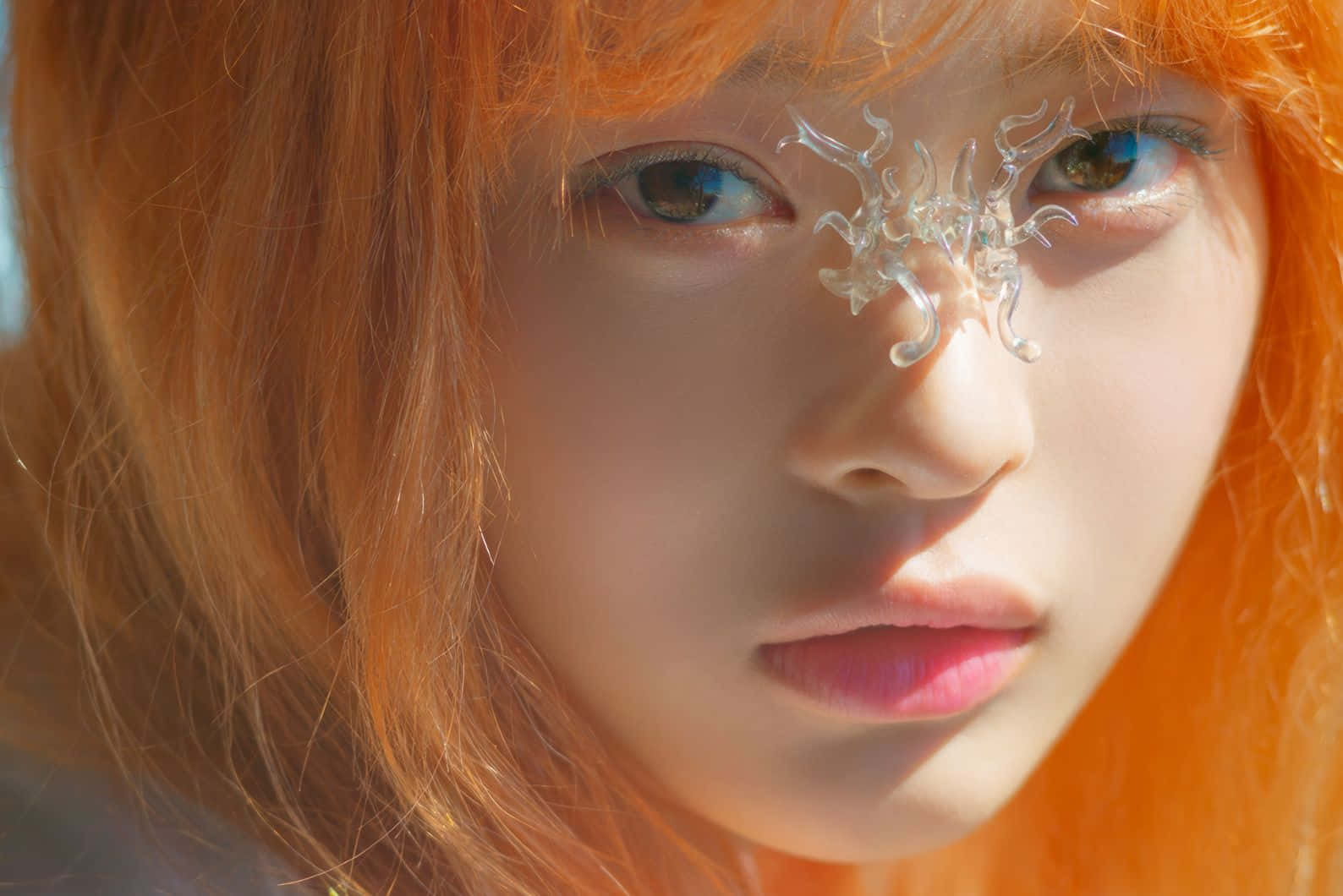 Orange Haired Personwith Crystal Accessory Wallpaper