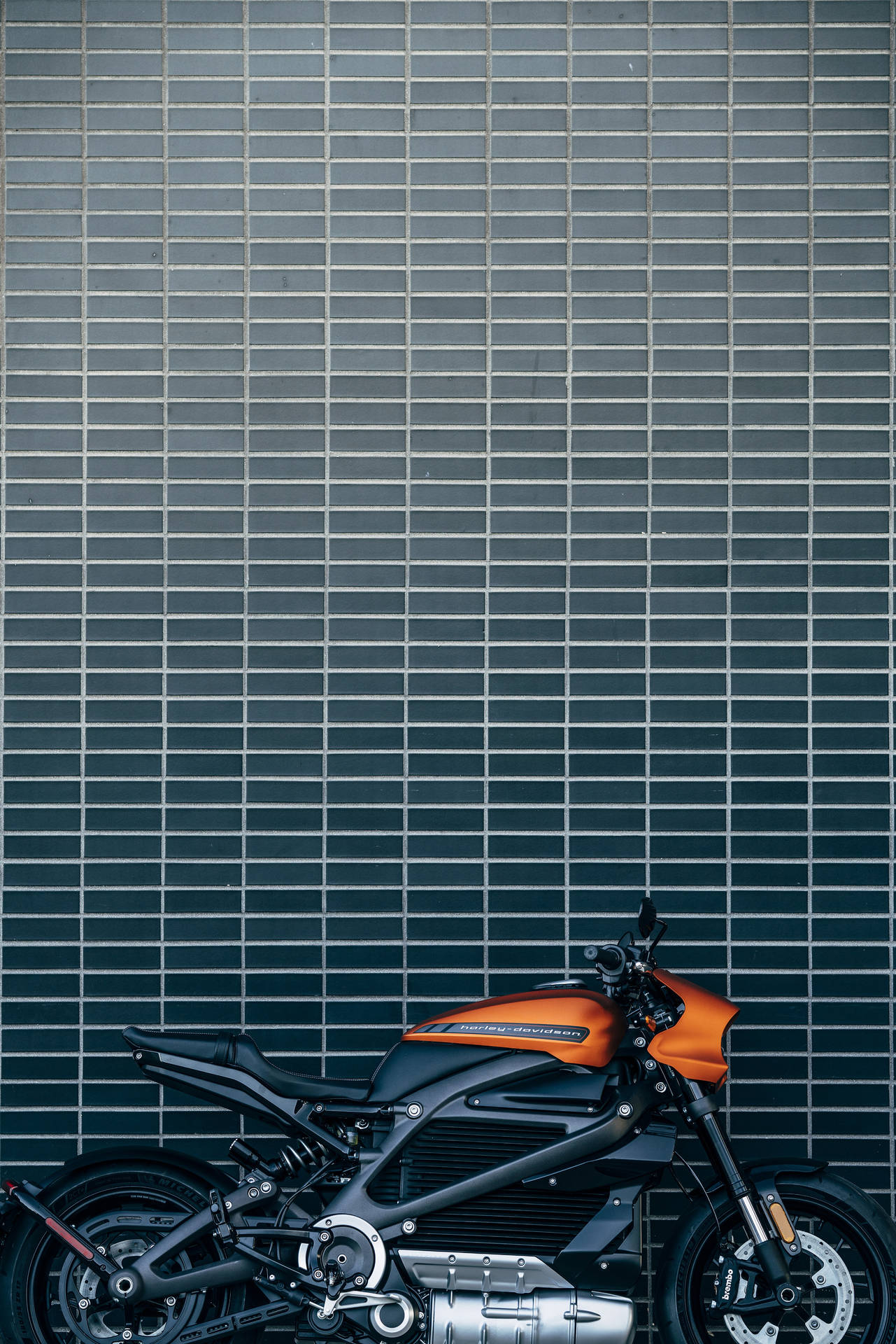 Orange Harley Davidson Motorcycle in Action Wallpaper
