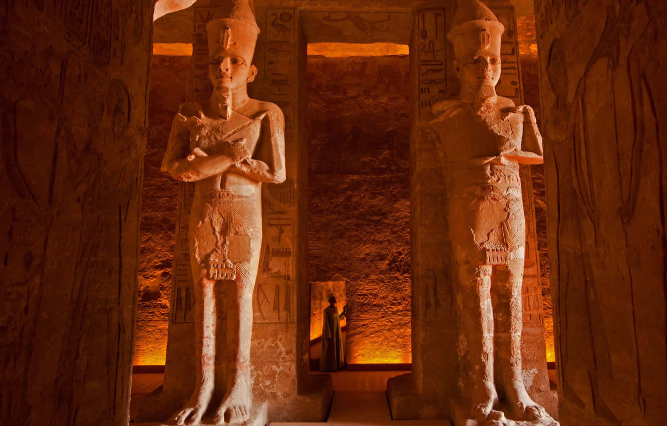 Orange Light Within The Statues Inside The Egyptian Museum Wallpaper
