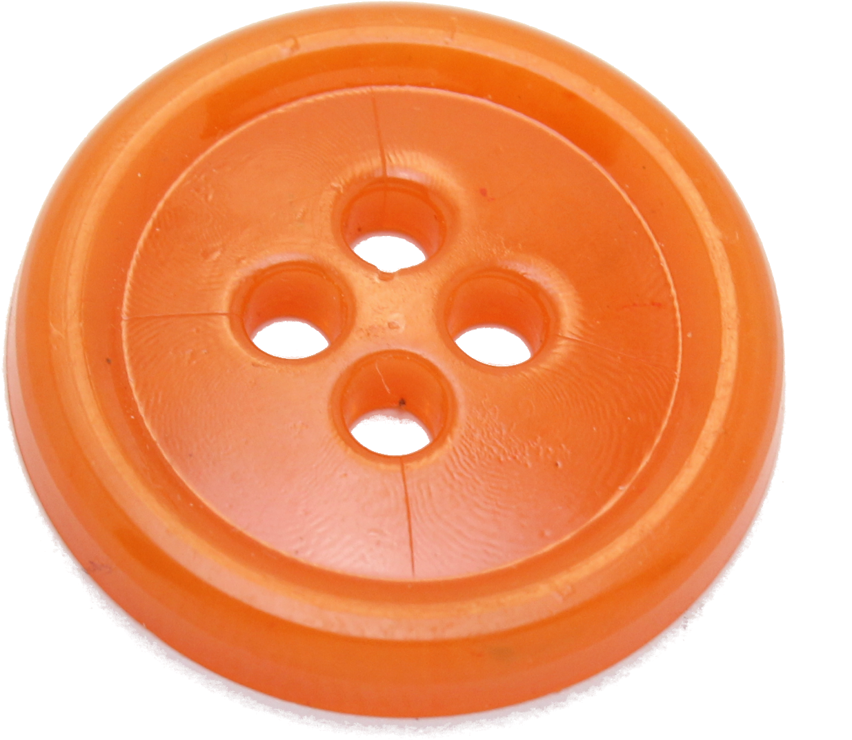 Orange Plastic Clothing Button PNG — A close-up of a bright orange plastic button with four holes and concentric ridges against a black background.