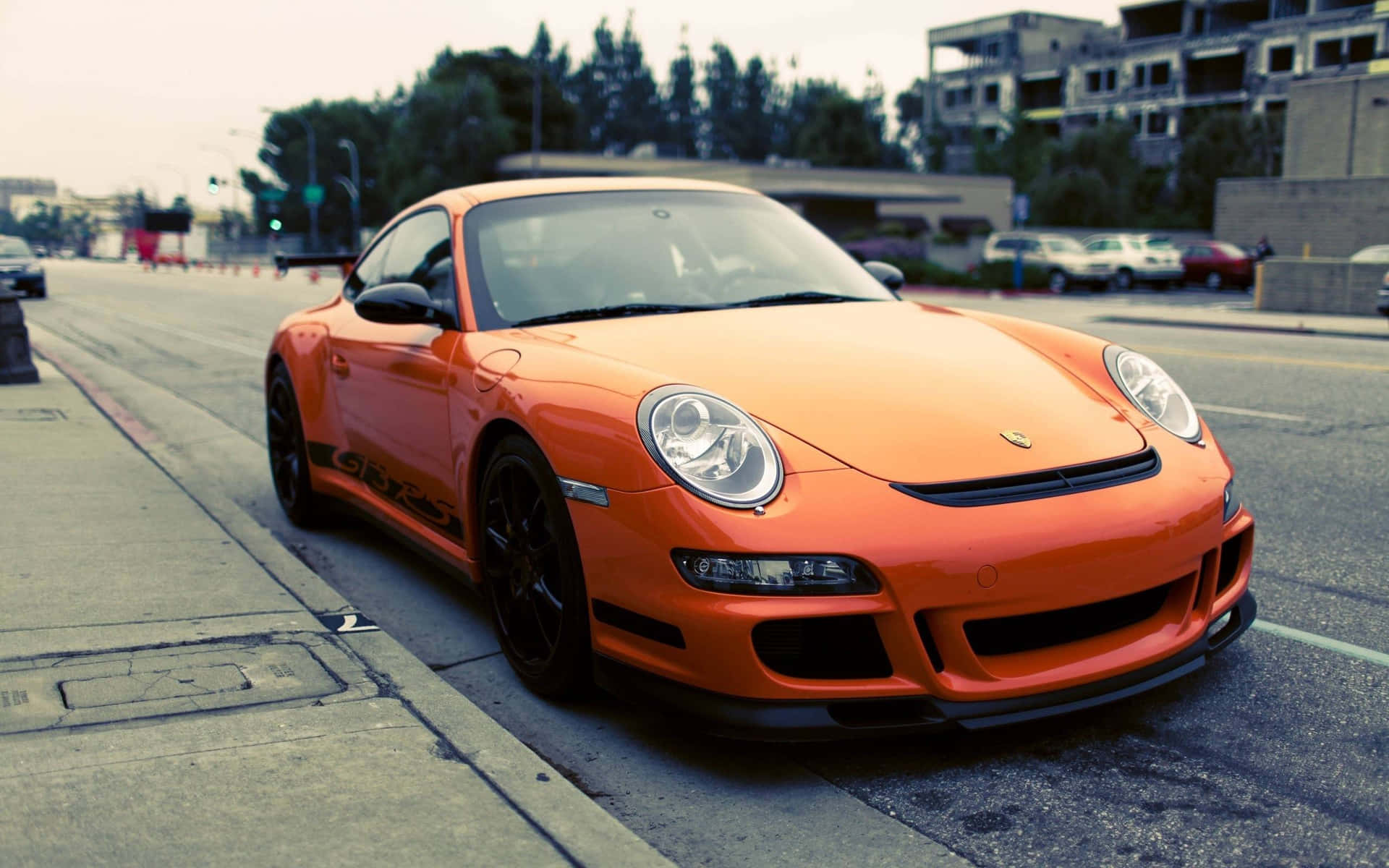 Orange Porsche G T3 R S Urban Setting Wallpaper