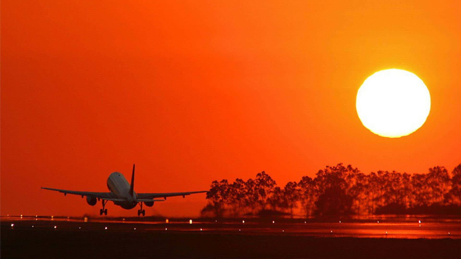 Orange Sunset And Plane Background Wallpaper