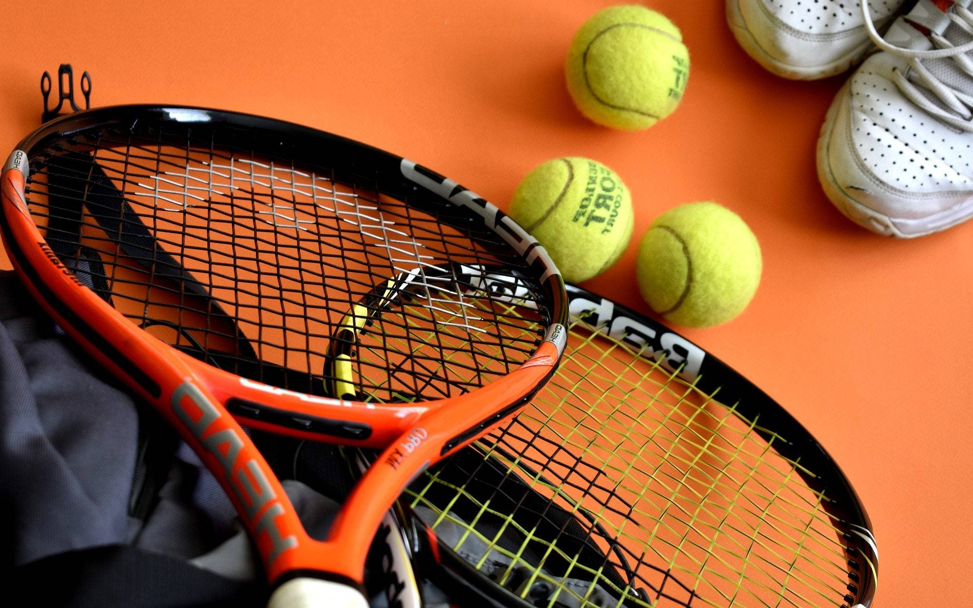 Orange Tennis Racket Wallpaper