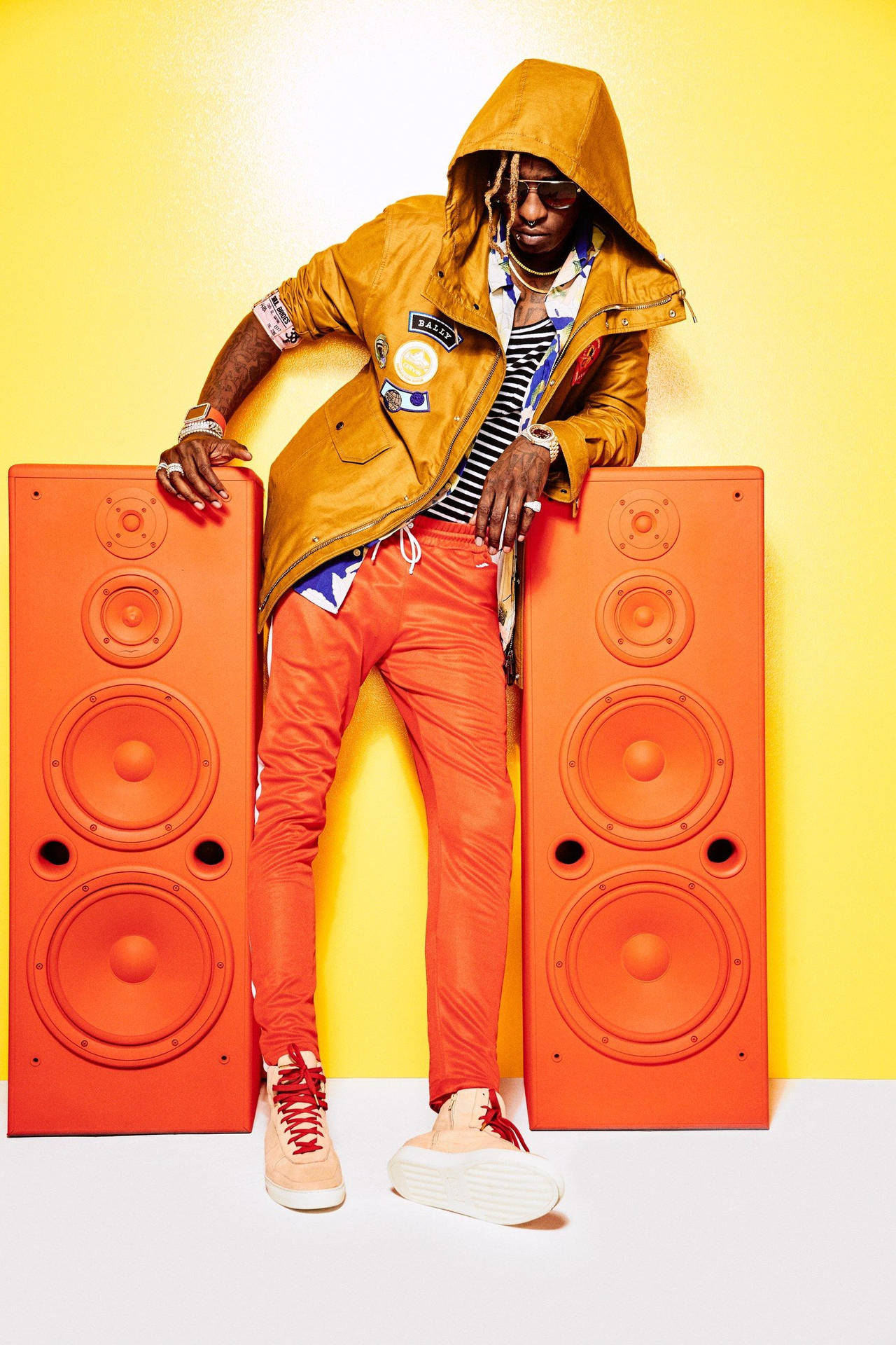 Young Thug expresses his eccentricity with an orange phone. Wallpaper